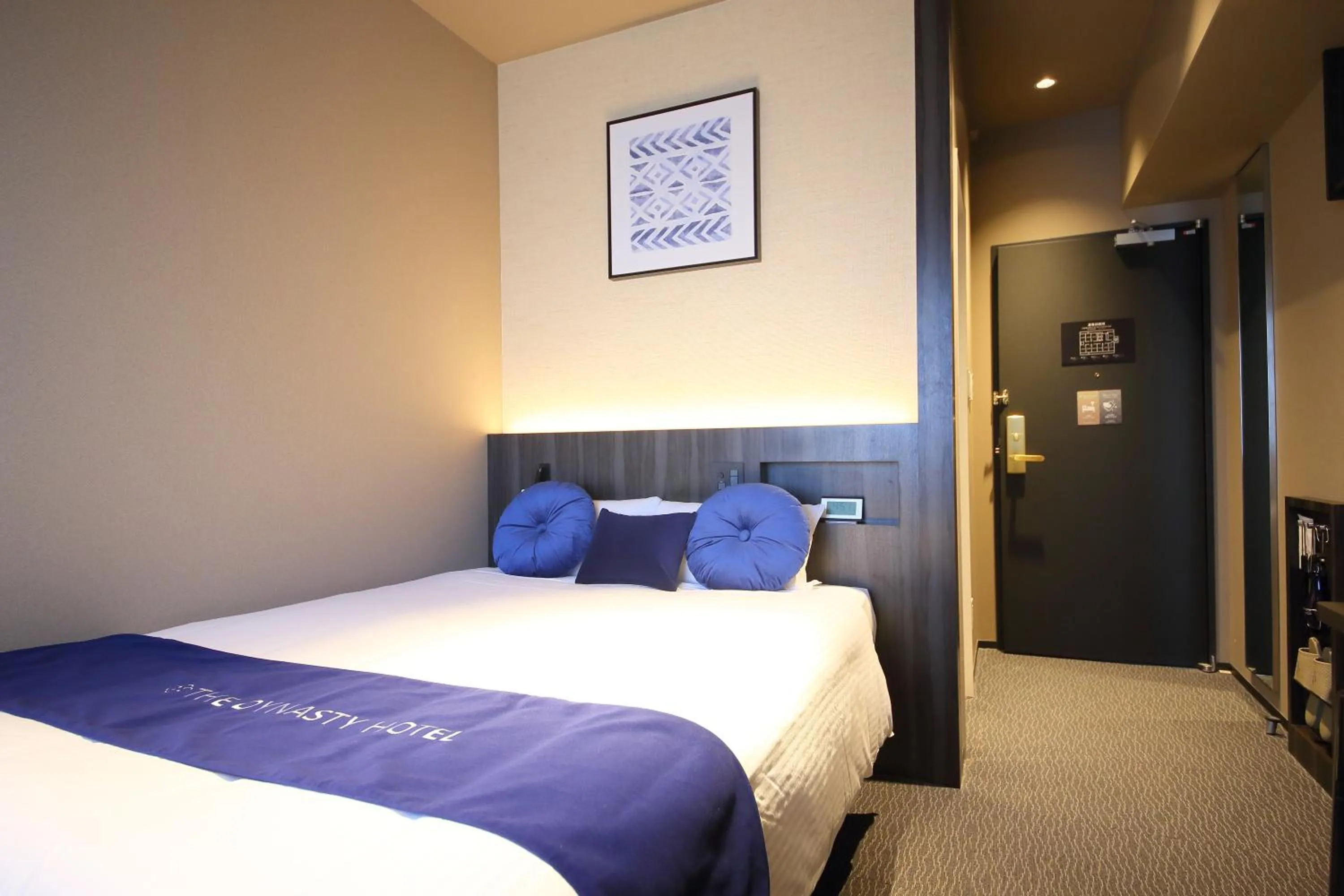 Bed in Dynasty Hotel & Resort Osaka