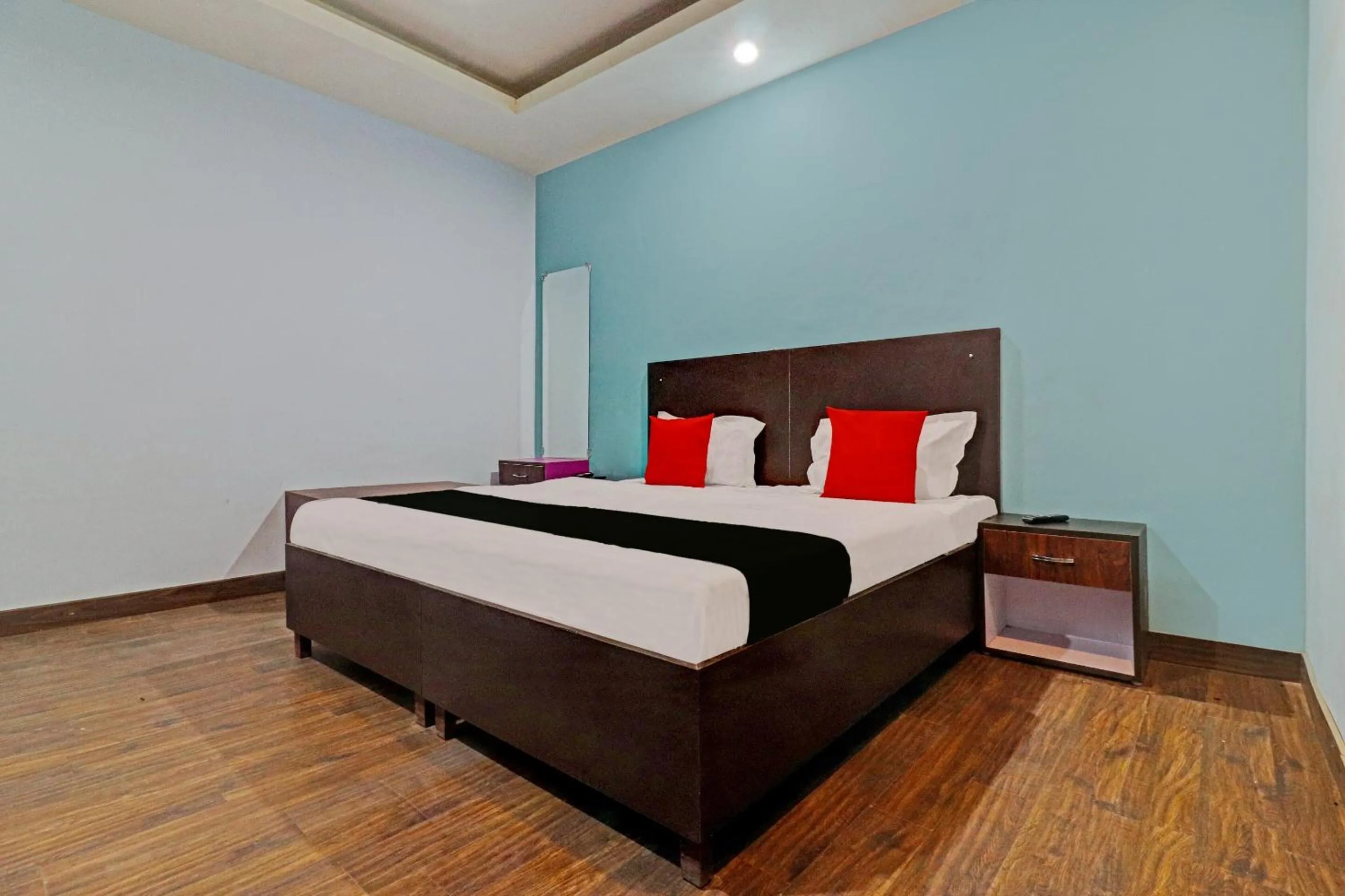 Bedroom in Capital O Kanha Resort