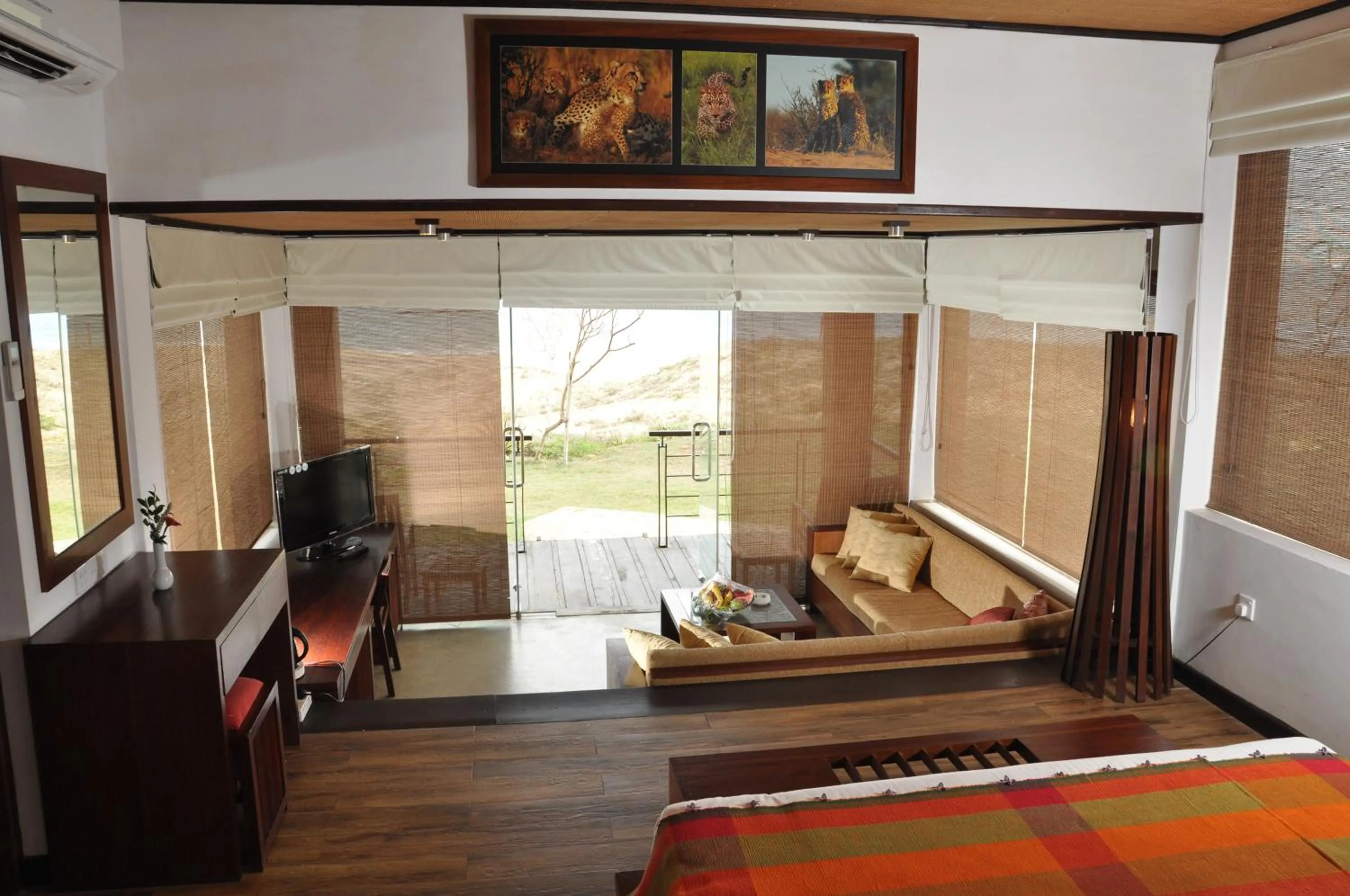 Living room, Bed in Laya Safari Resorts & Spa