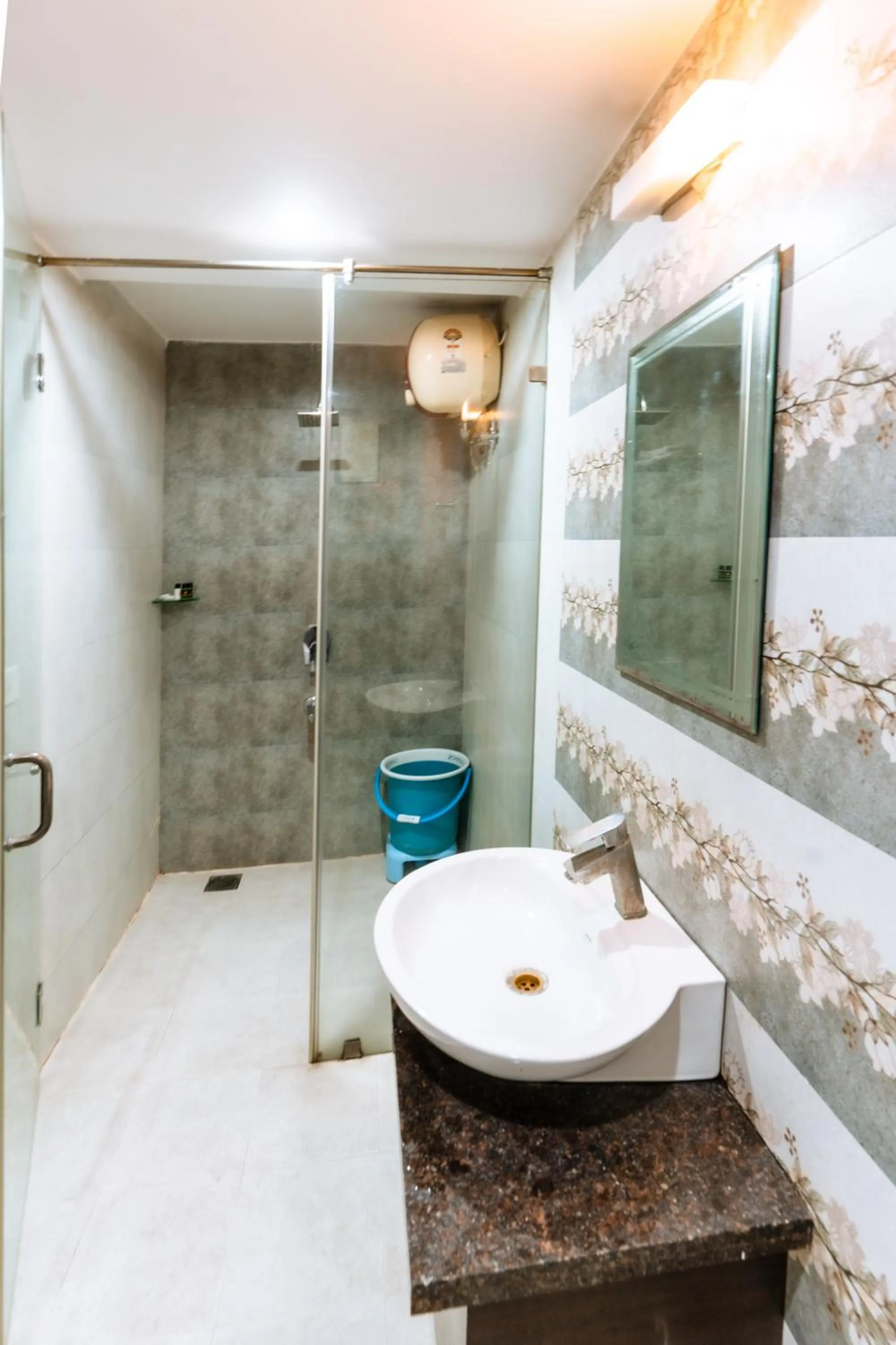 Bathroom in Hotel Krishna by KeyMagics