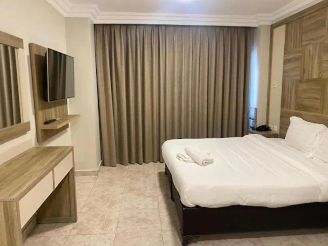 Bed in Mass Paradise Hotel