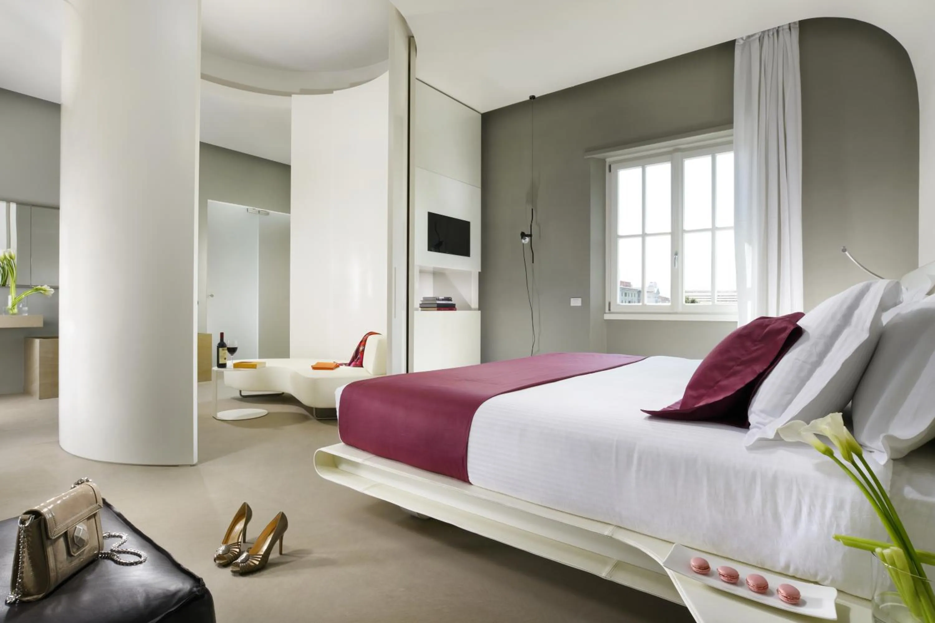 Bed in Palazzo Montemartini Rome, A Radisson Collection Hotel