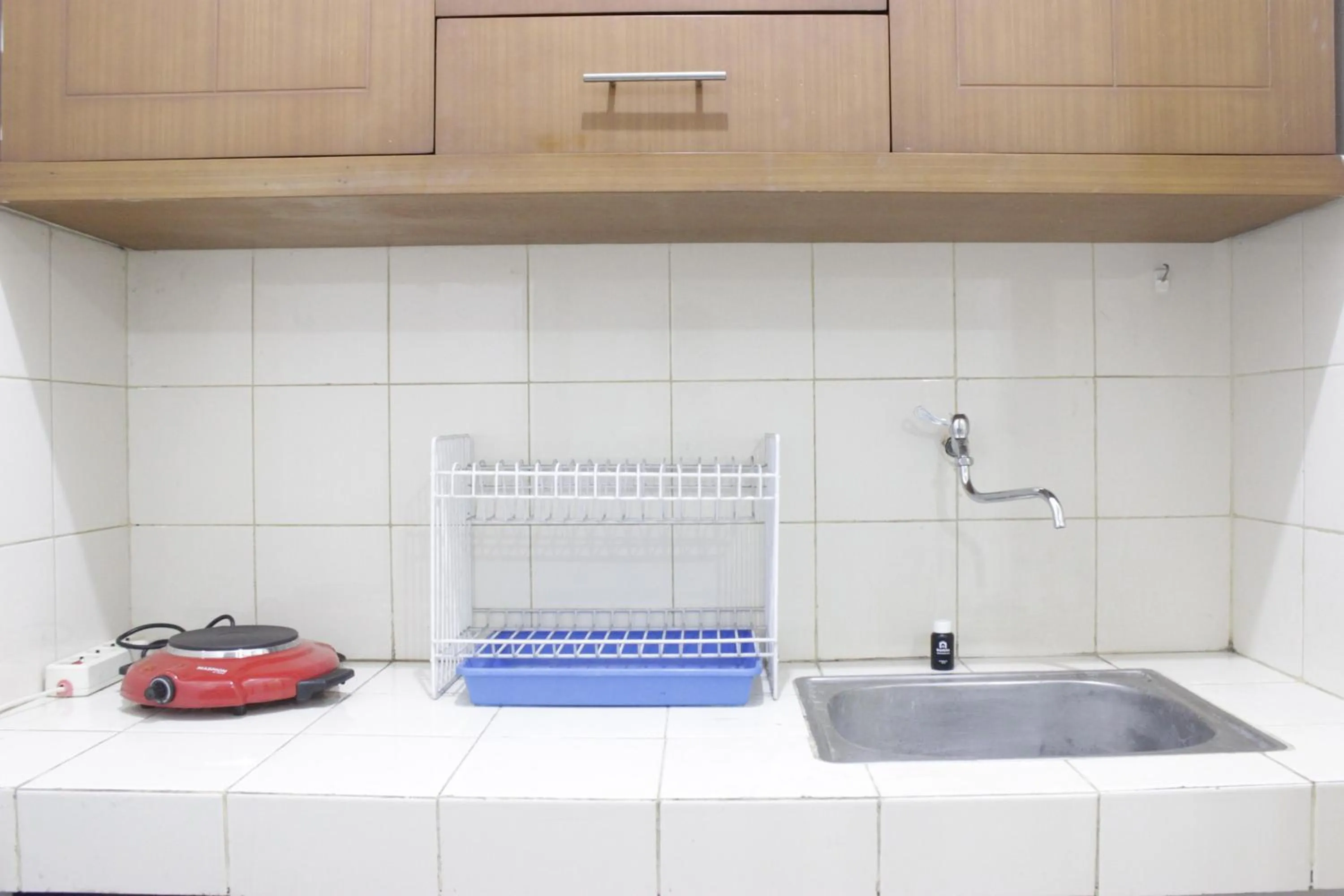 Kitchen or kitchenette in Homey 2BR Majesty Apartment near Maranatha University By Travelio