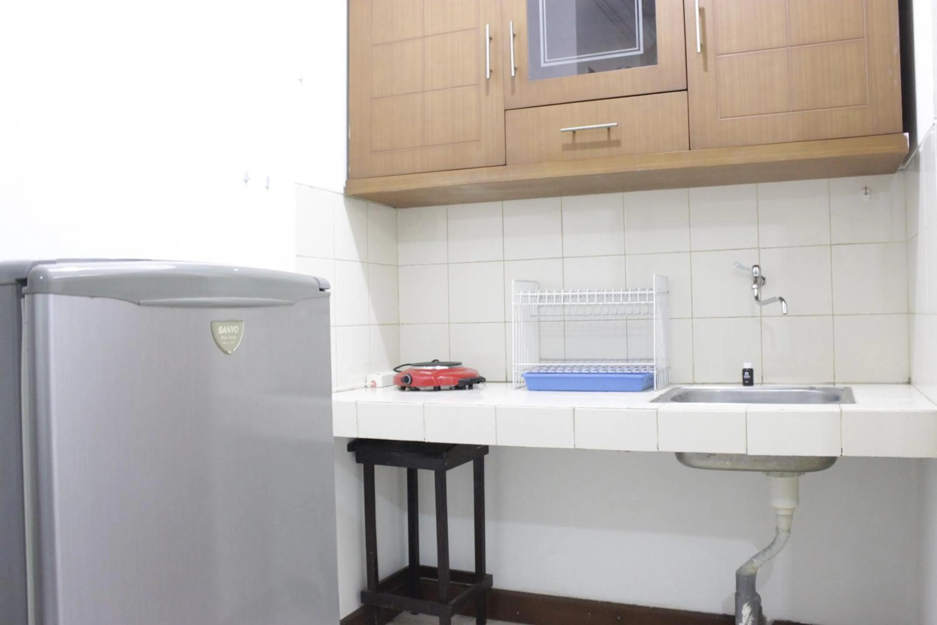 Kitchen or kitchenette in Homey 2BR Majesty Apartment near Maranatha University By Travelio