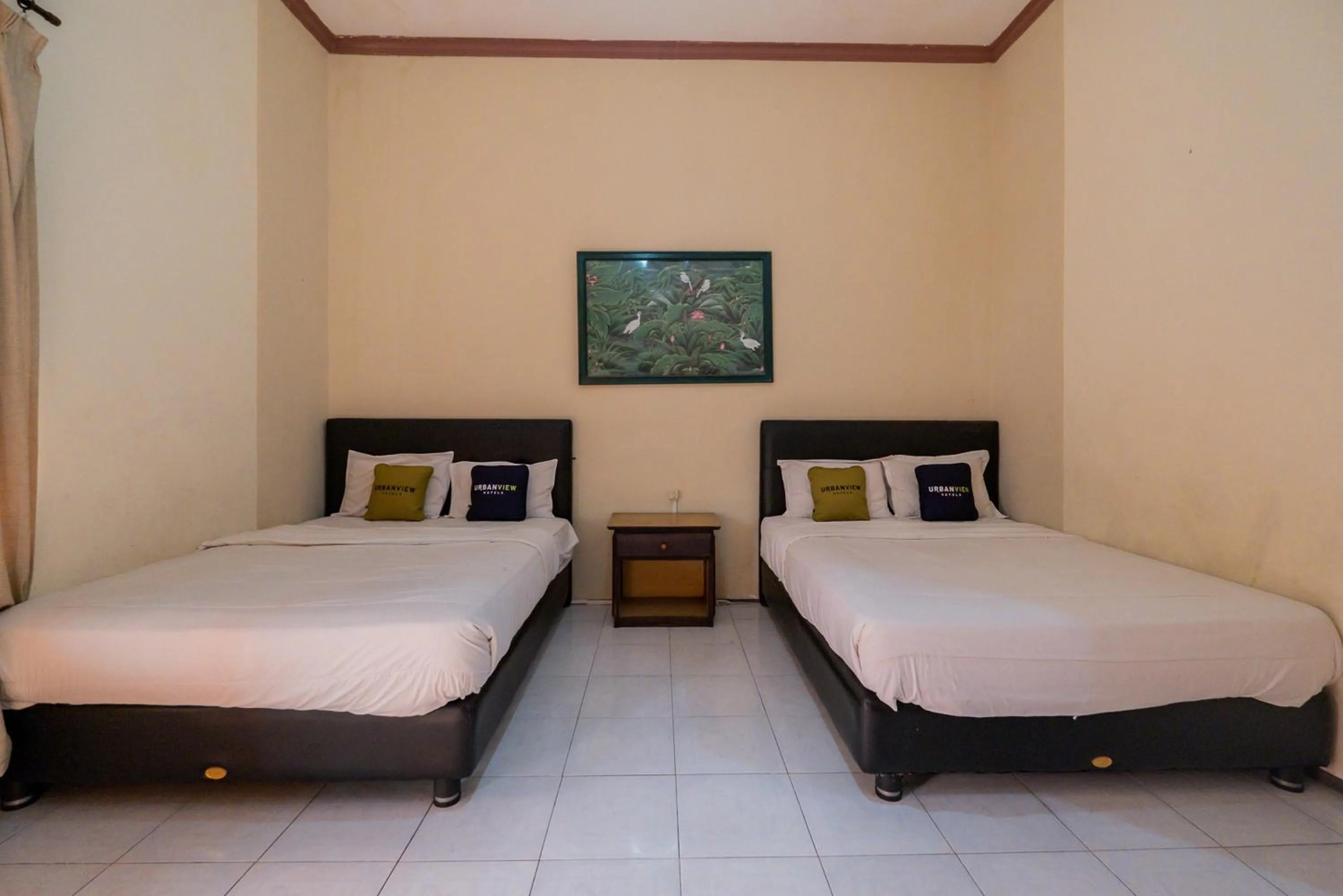 Bed in Urbanview Hotel Near Jatim Park 1 by RedDoorz