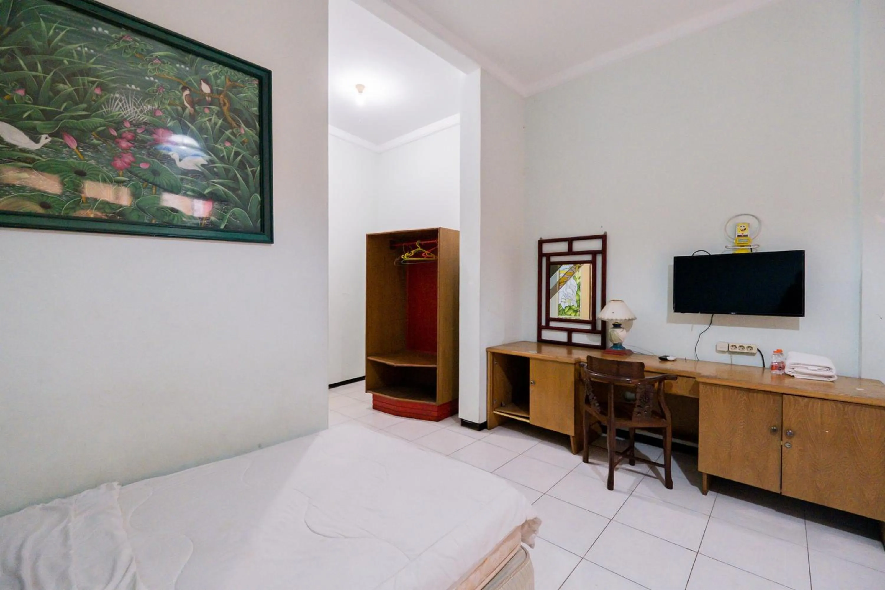 Bed in Urbanview Hotel Near Jatim Park 1 by RedDoorz