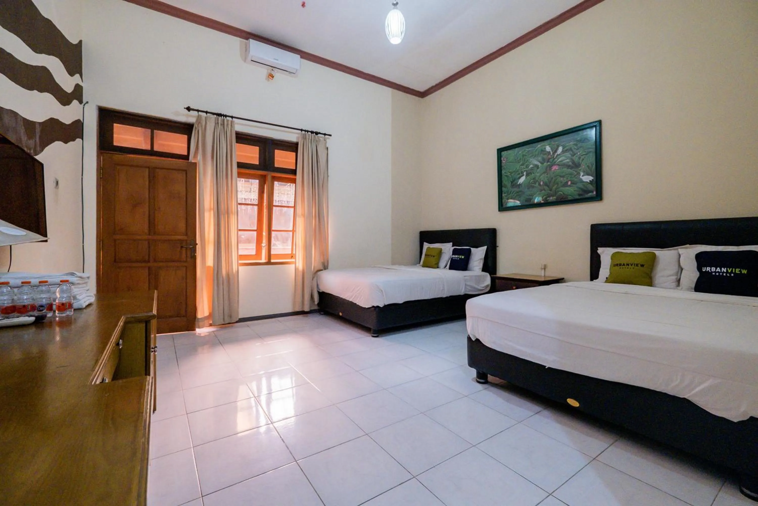 Bed in Urbanview Hotel Near Jatim Park 1 by RedDoorz