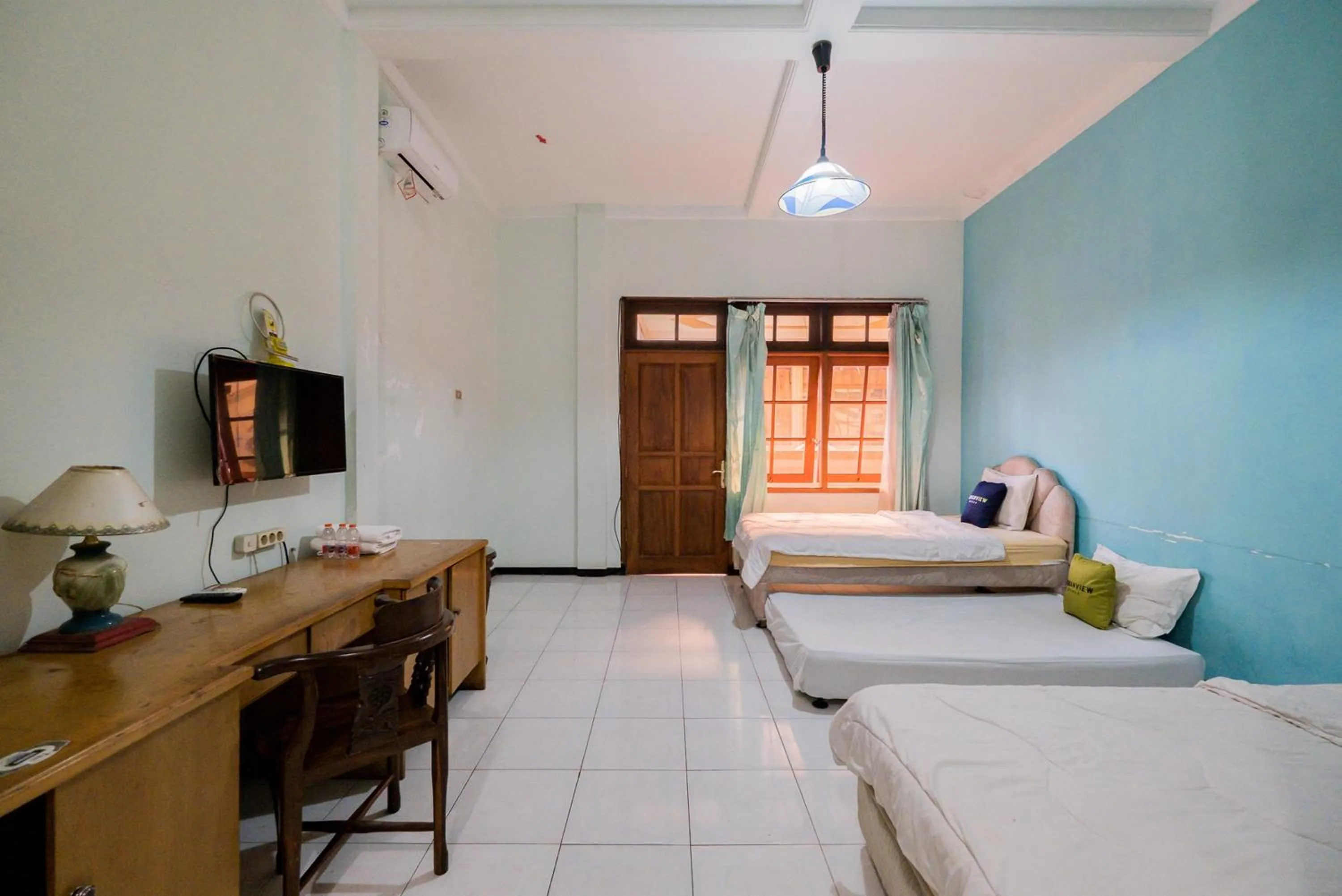 Bed in Urbanview Hotel Near Jatim Park 1 by RedDoorz