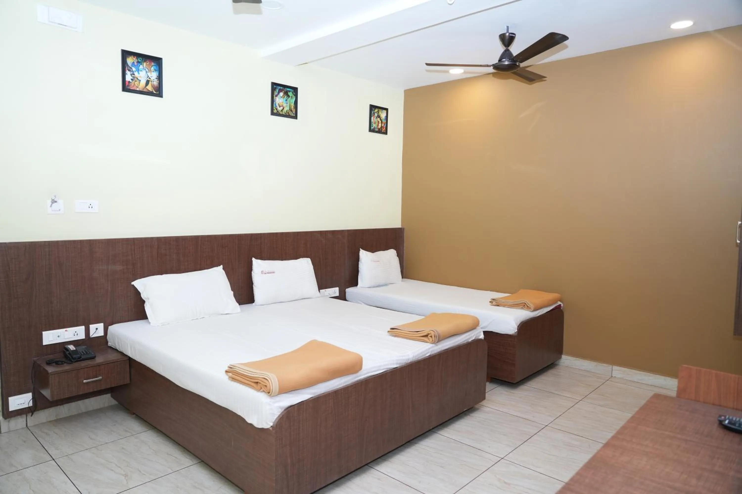 Photo of the whole room, Bed in Sri Krishnan Residency