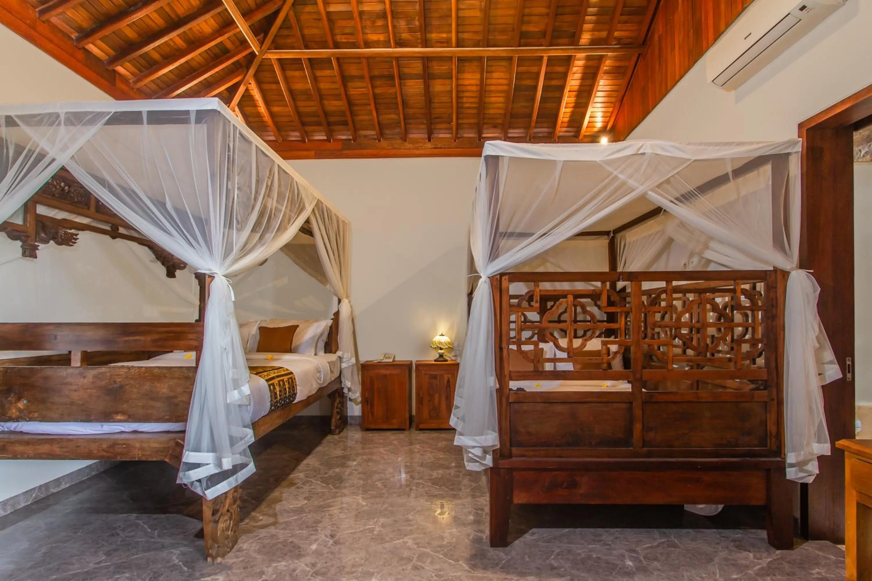 Photo of the whole room, Bed in Graha Petulu Ubud by GenuineHost