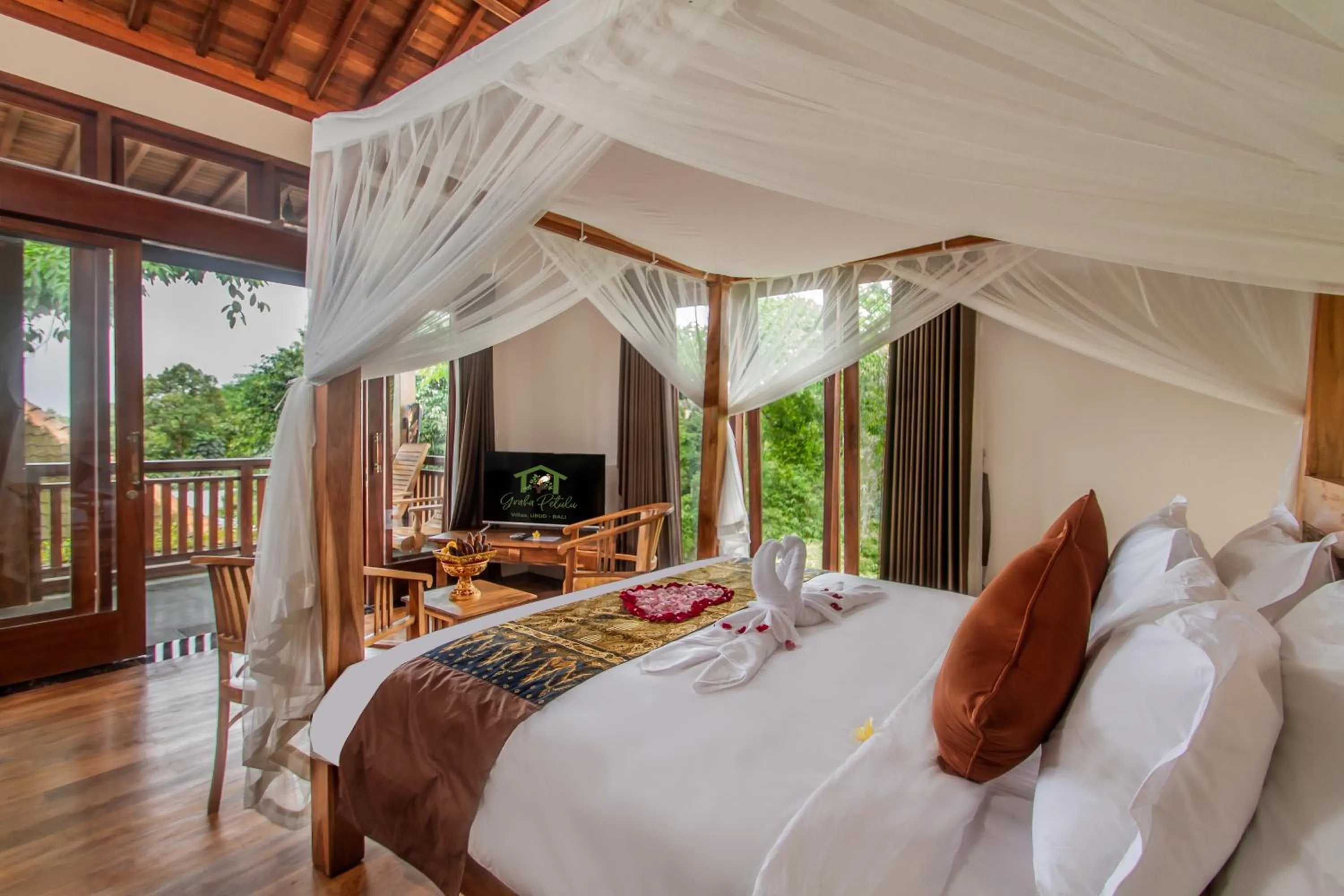 Photo of the whole room, Bed in Graha Petulu Ubud by GenuineHost