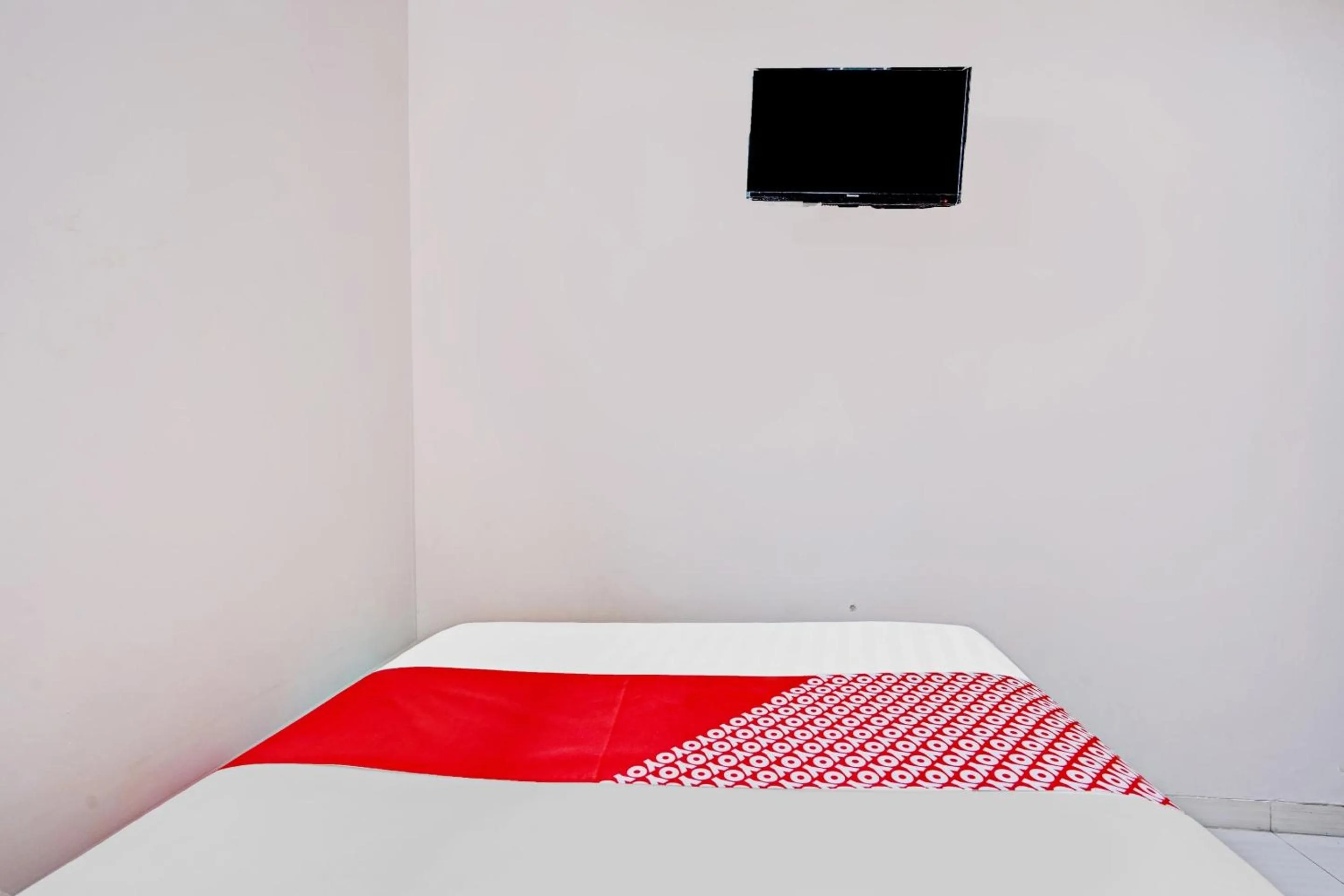 Bedroom in OYO 90234 Dhoho Family Guest House