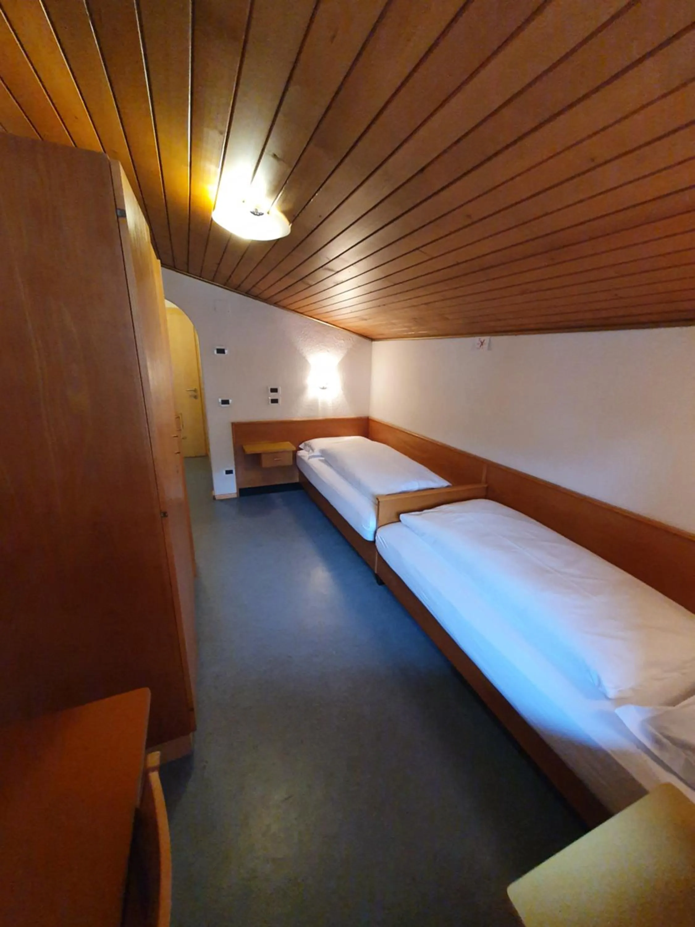 Photo of the whole room, Bed in ALBERGO BAR RISTORANTE DOLOMIA