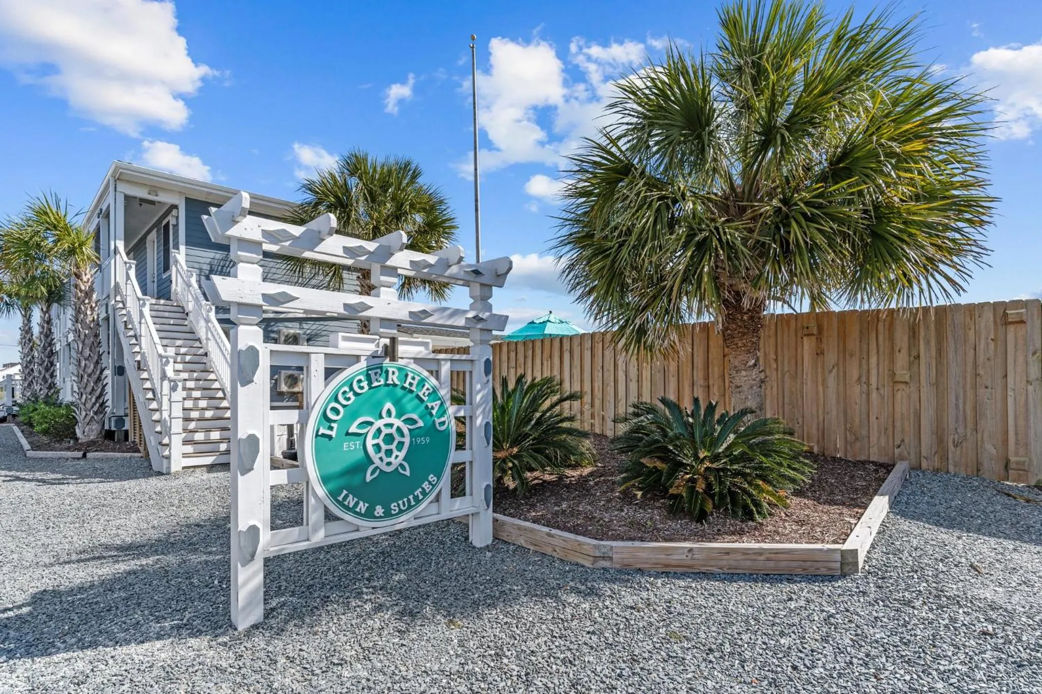 Logo/Certificate/Sign in Loggerhead Inn and Suites