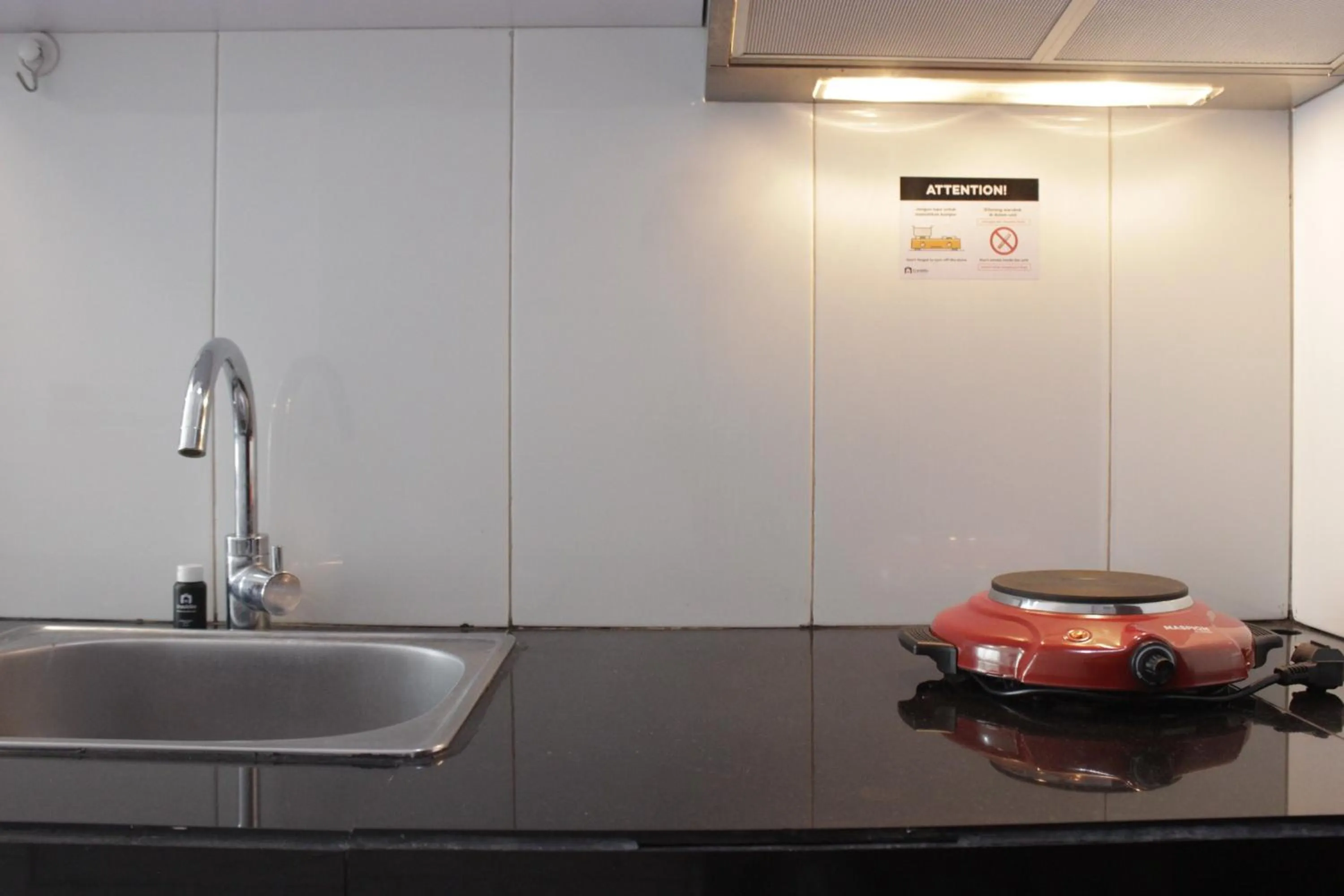 Kitchen or kitchenette in Strategic & Stylish Studio Gateway Pasteur Apartment near Pasteur Exit Toll By Travelio