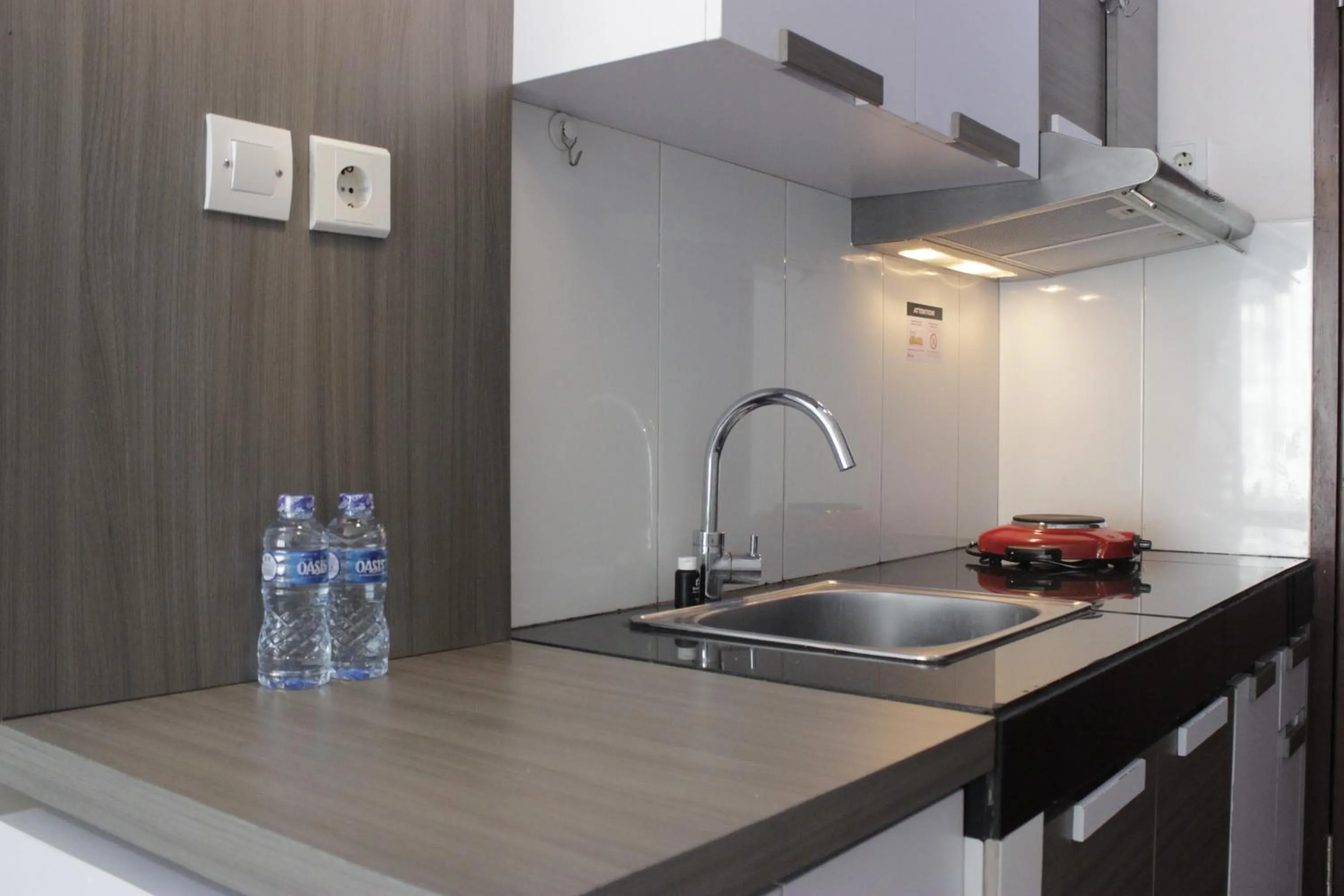 Kitchen or kitchenette in Strategic & Stylish Studio Gateway Pasteur Apartment near Pasteur Exit Toll By Travelio