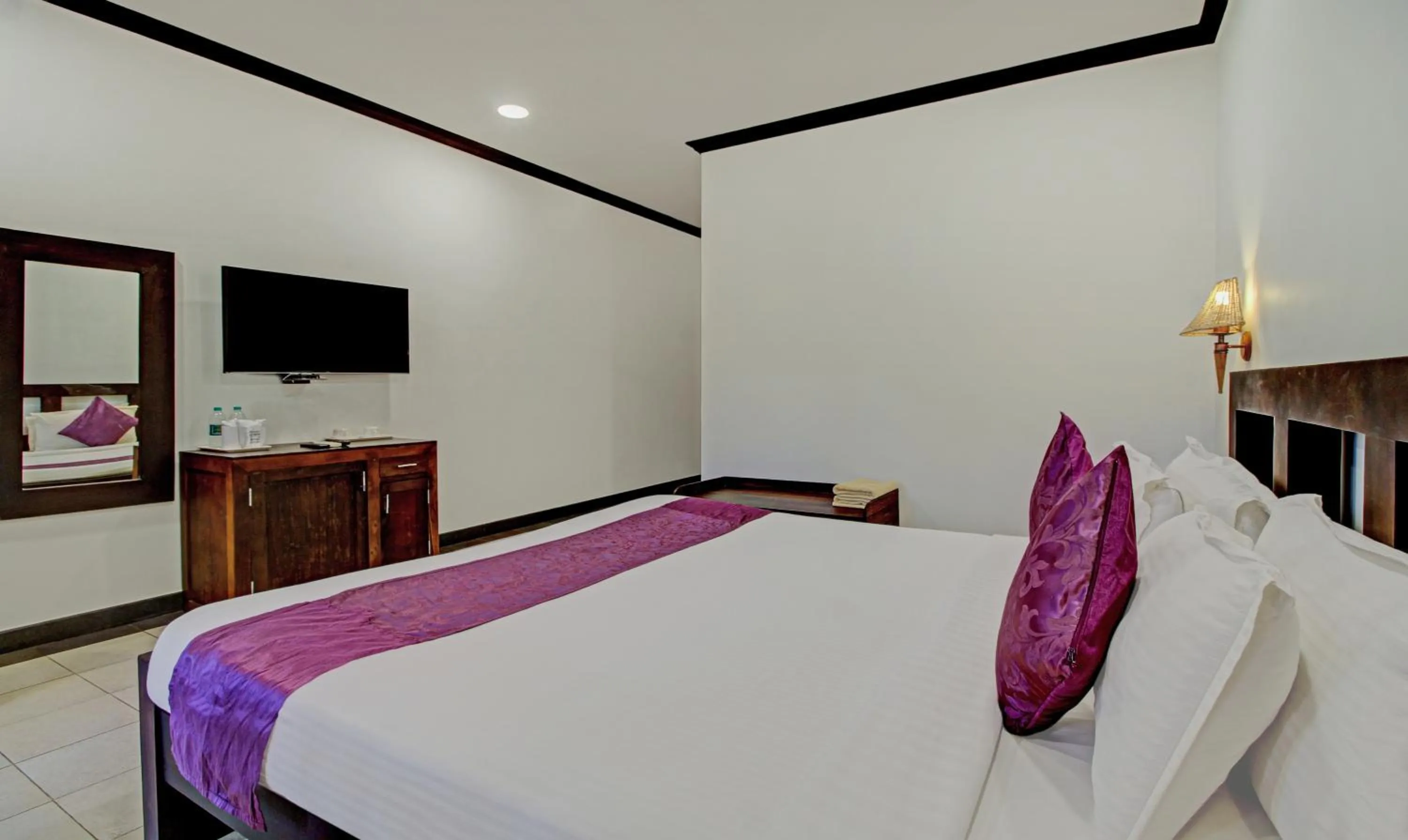 Bedroom, Bed in Treebo Premium Travancore Palace Cherthala