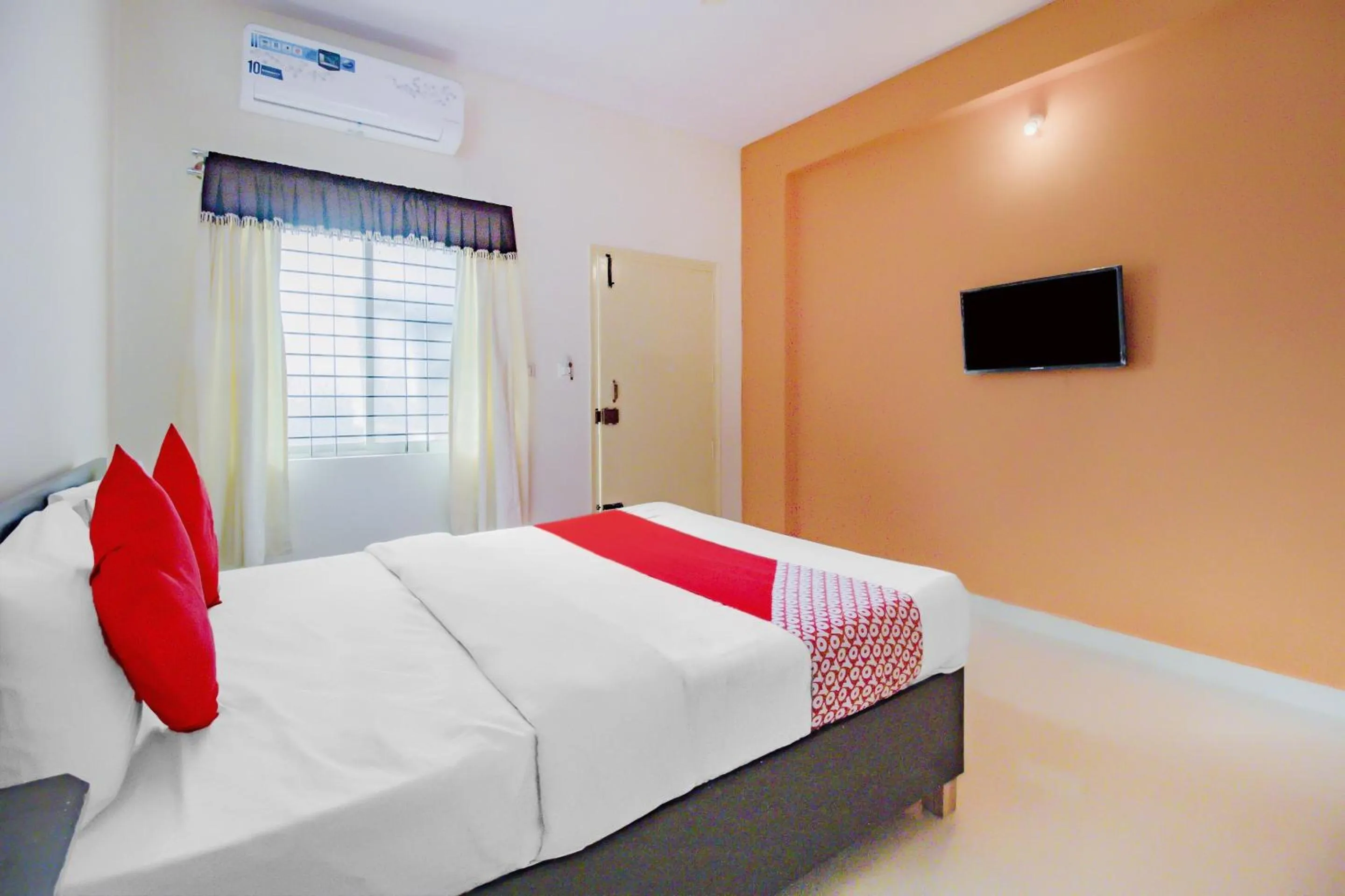 Bedroom in Hotel O P N K Suites