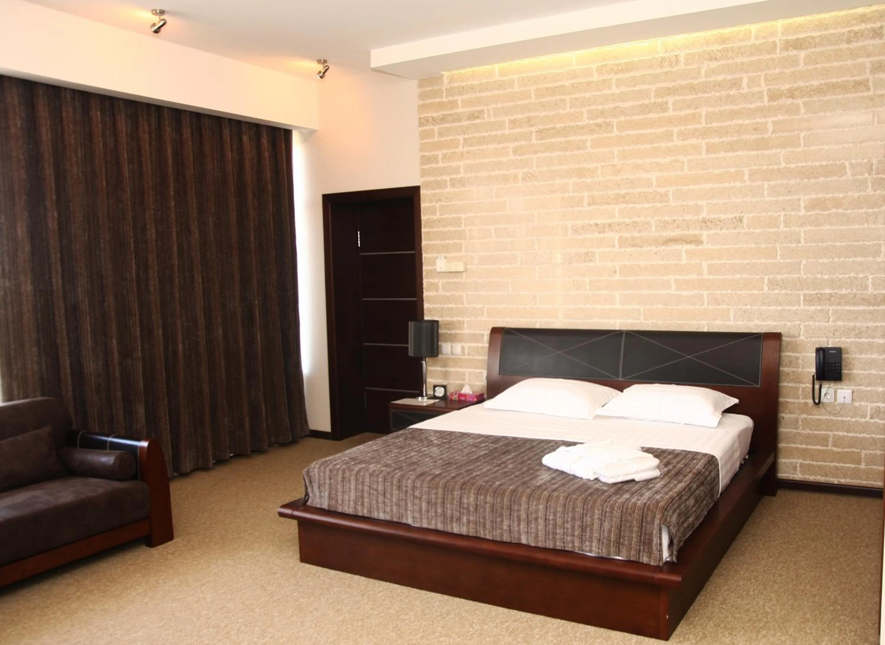 Bed in Grand M Hotel