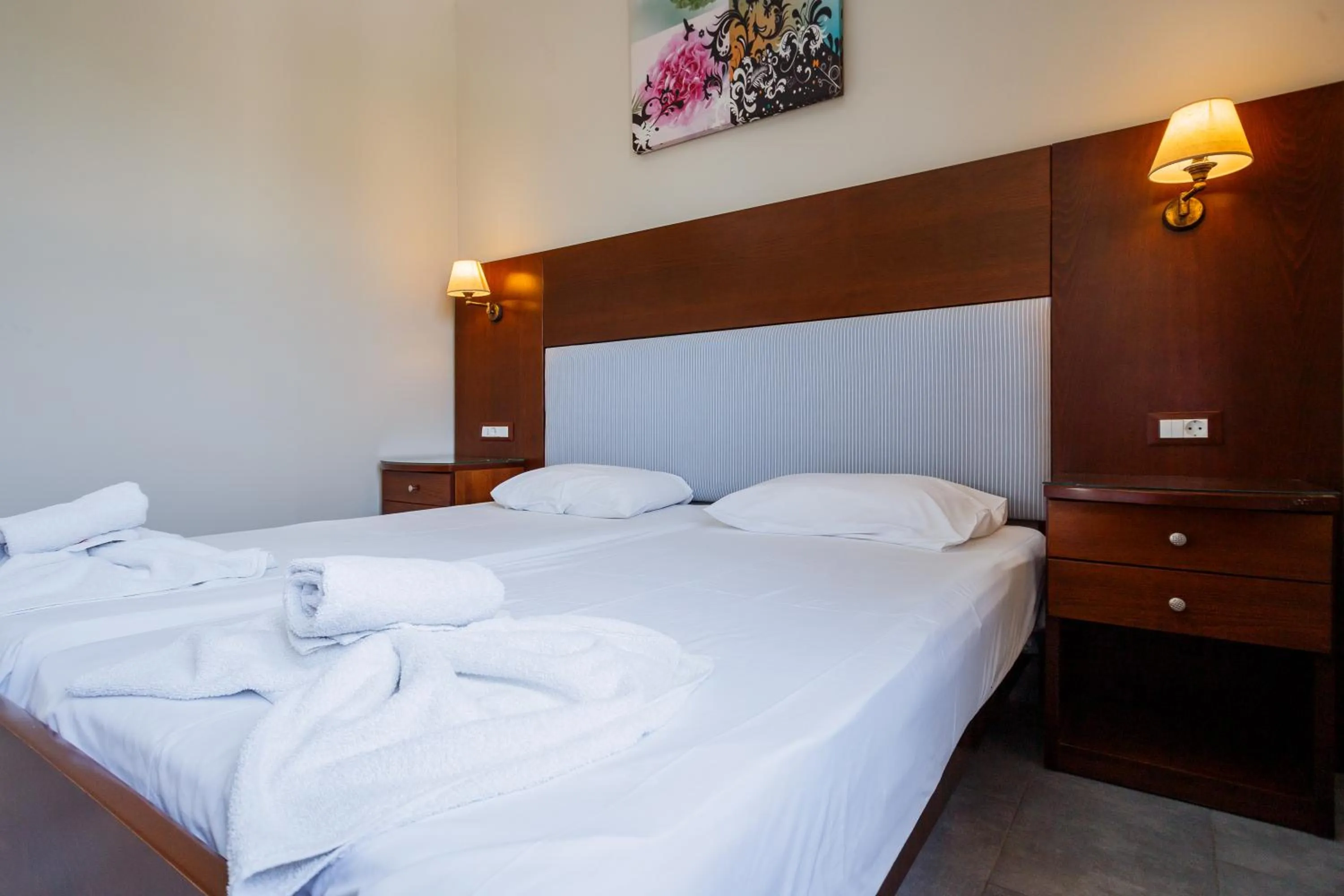 Bed in Rose Club Apartments