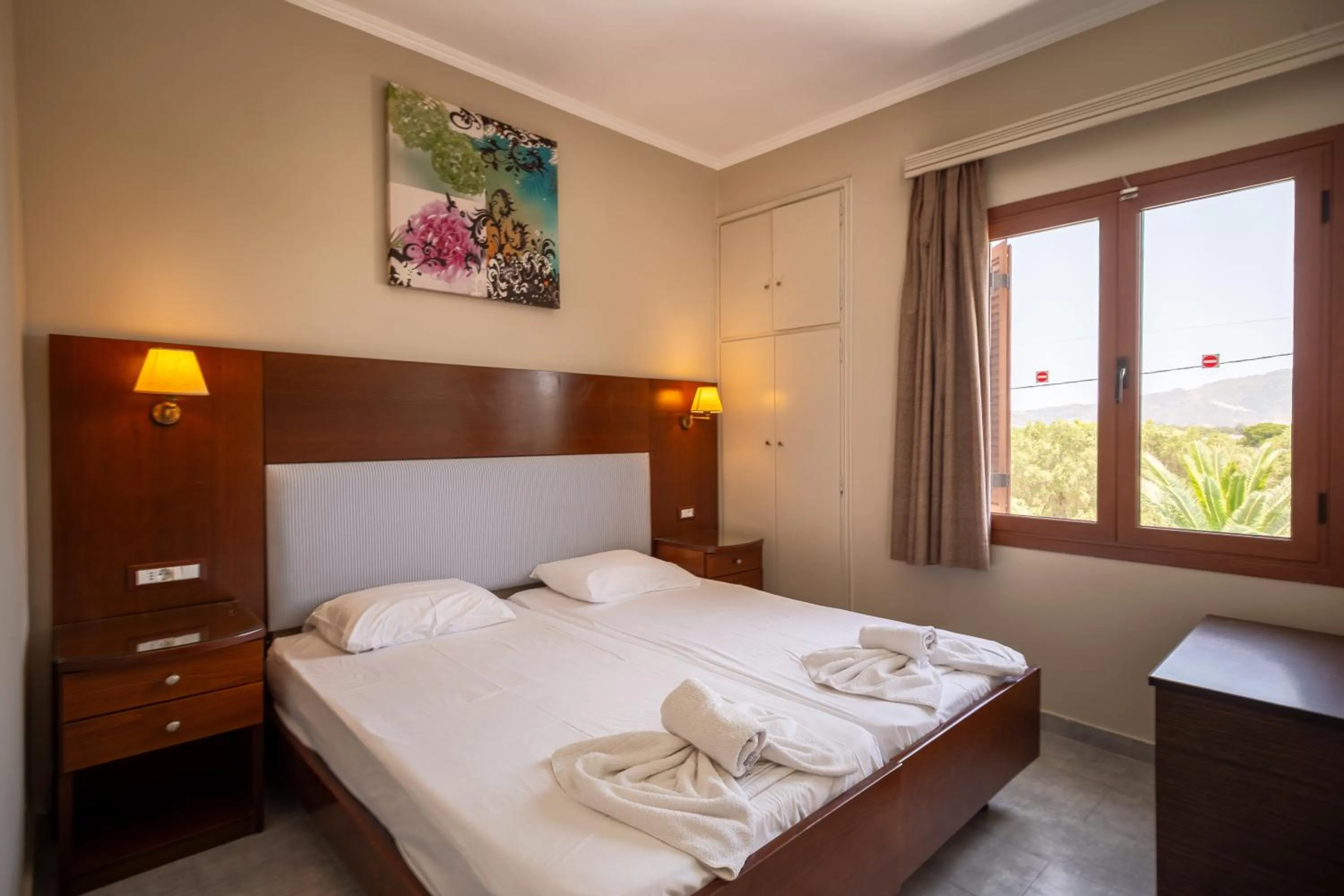 Bed in Rose Club Apartments