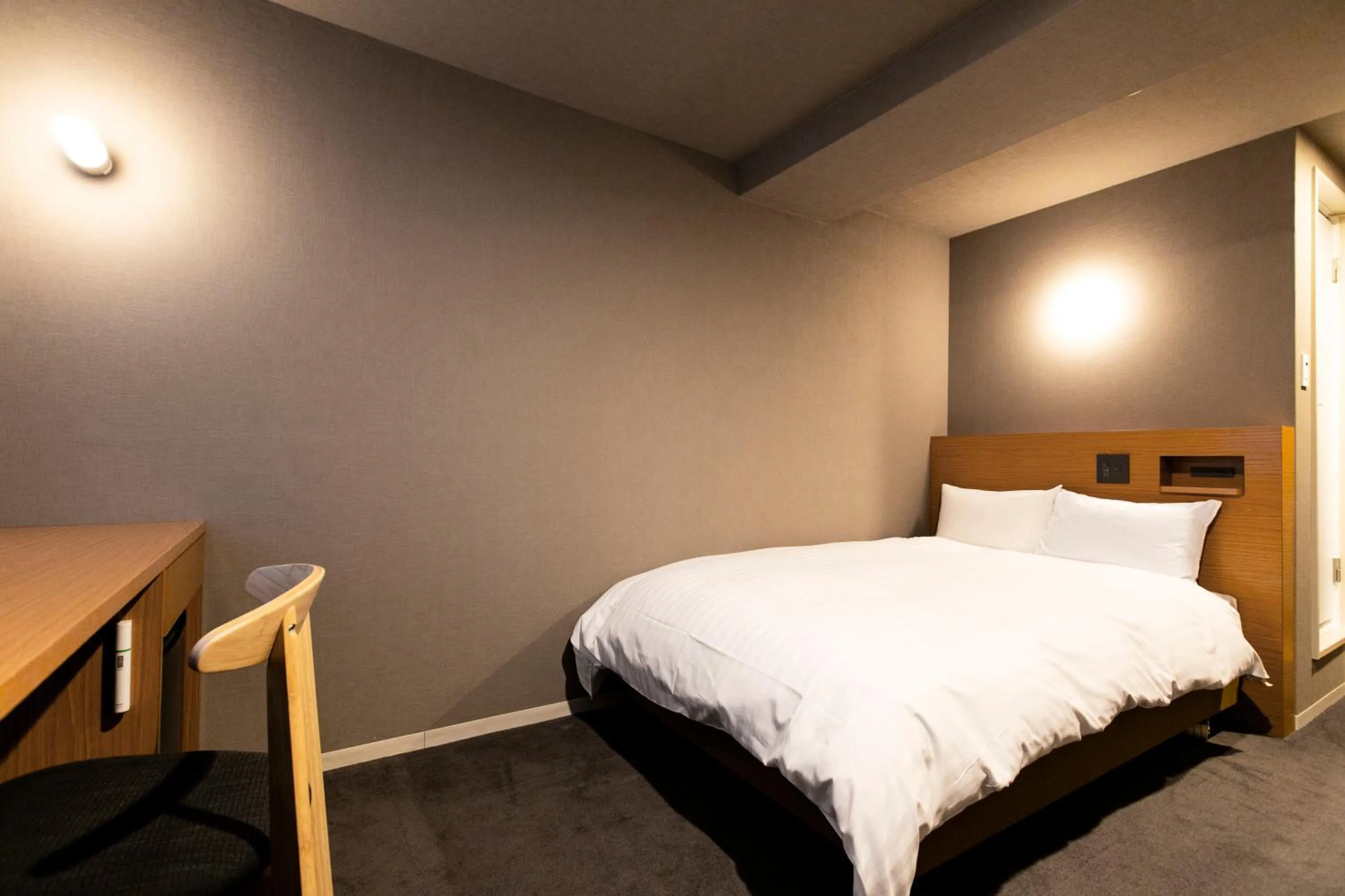 Bed in Hotel New Nishino