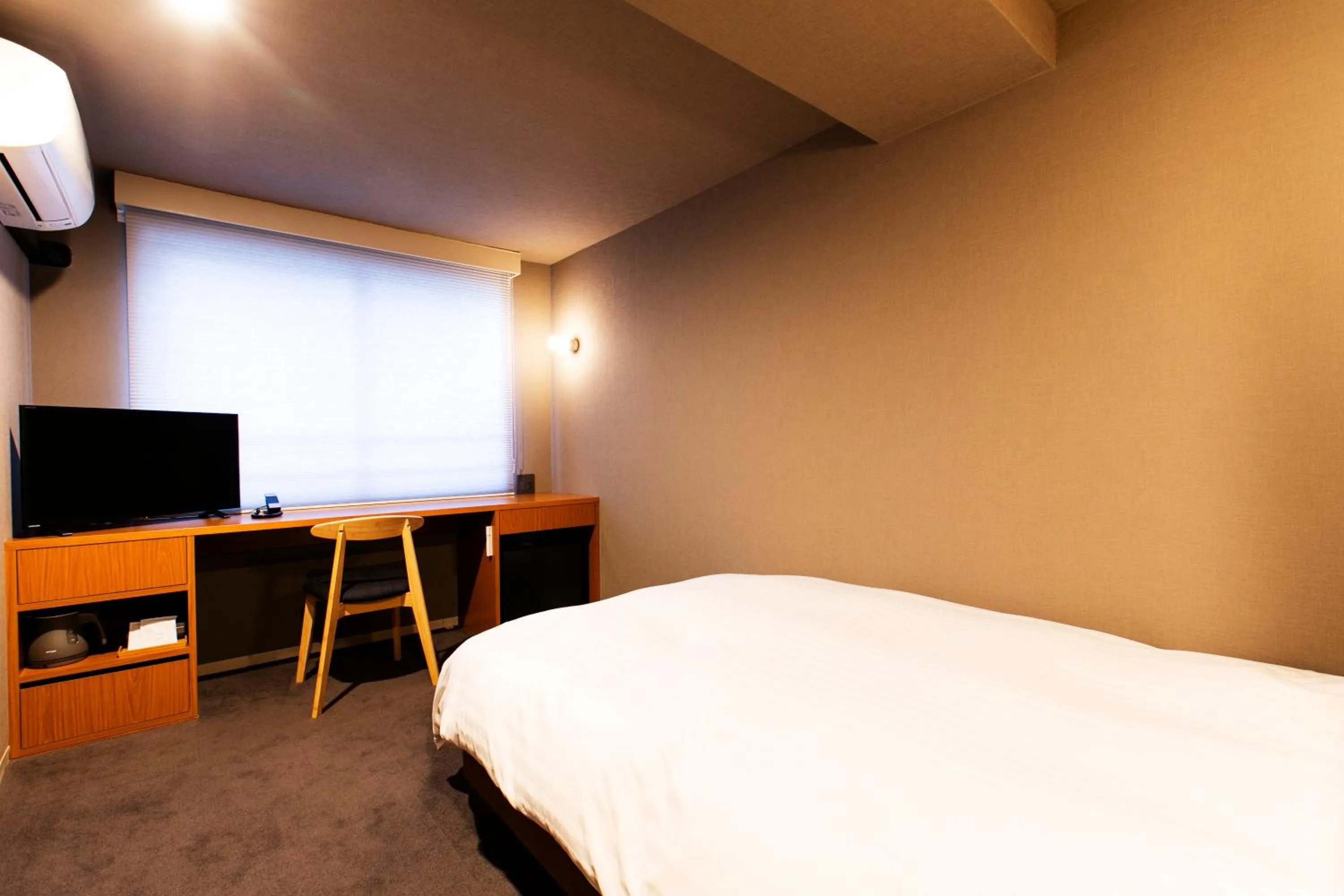 Bed in Hotel New Nishino
