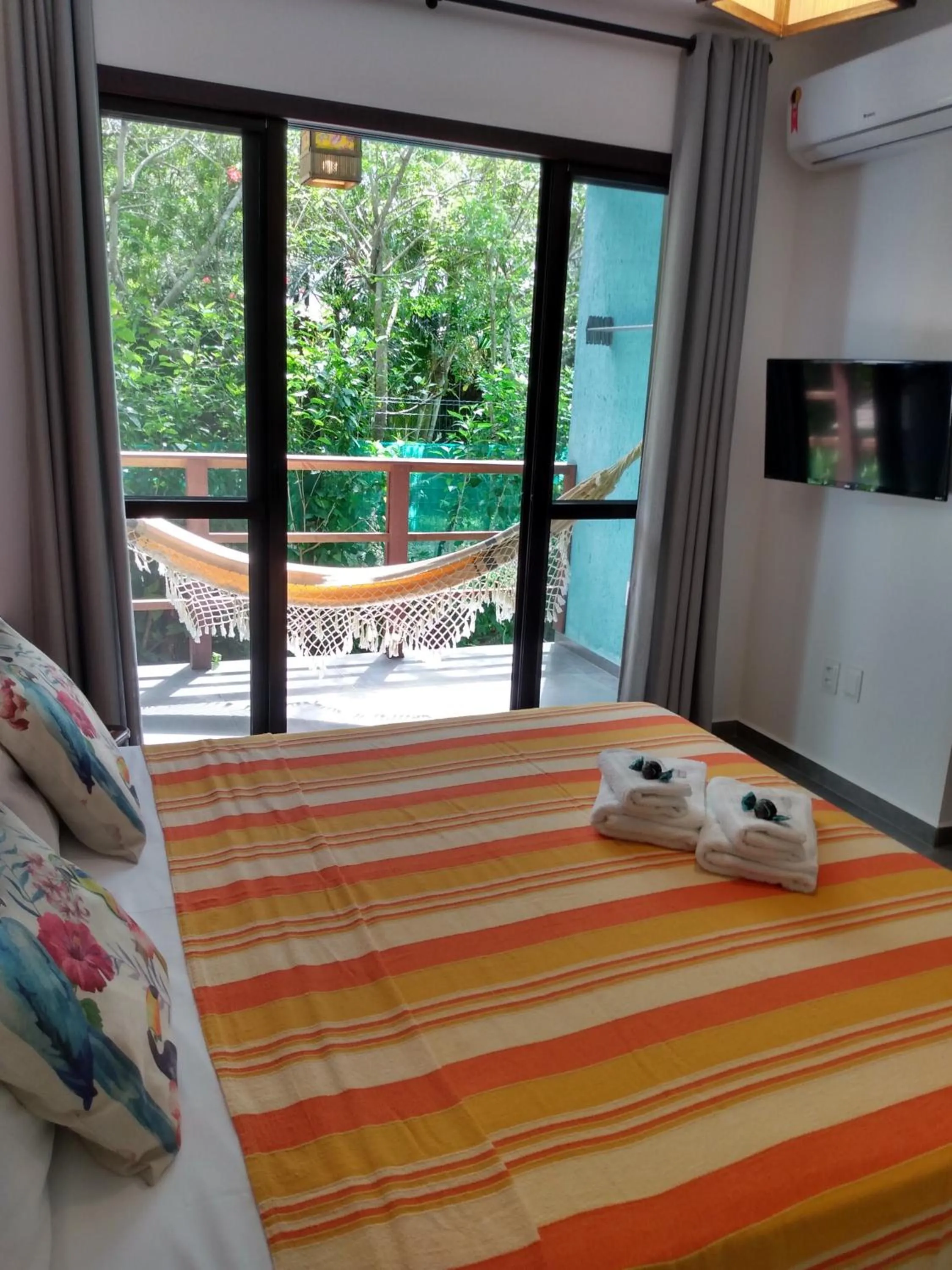 Bed in Pousada Vila Guyrá