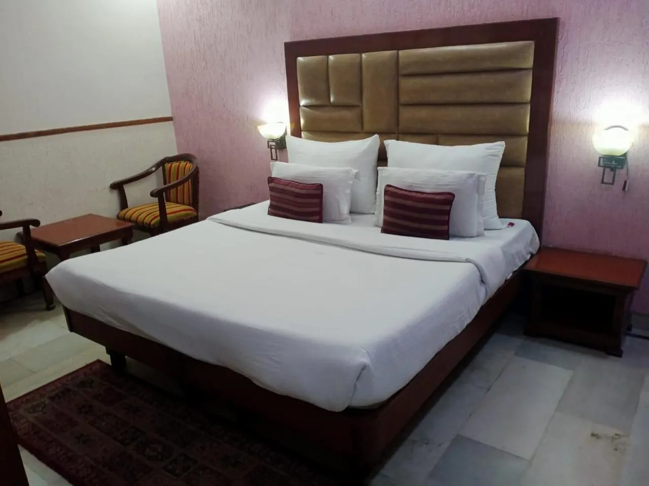 Bed in HOTEL CORPORATE INN