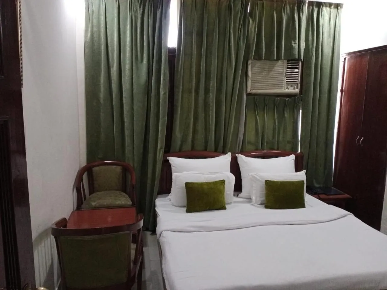 Bed in HOTEL CORPORATE INN