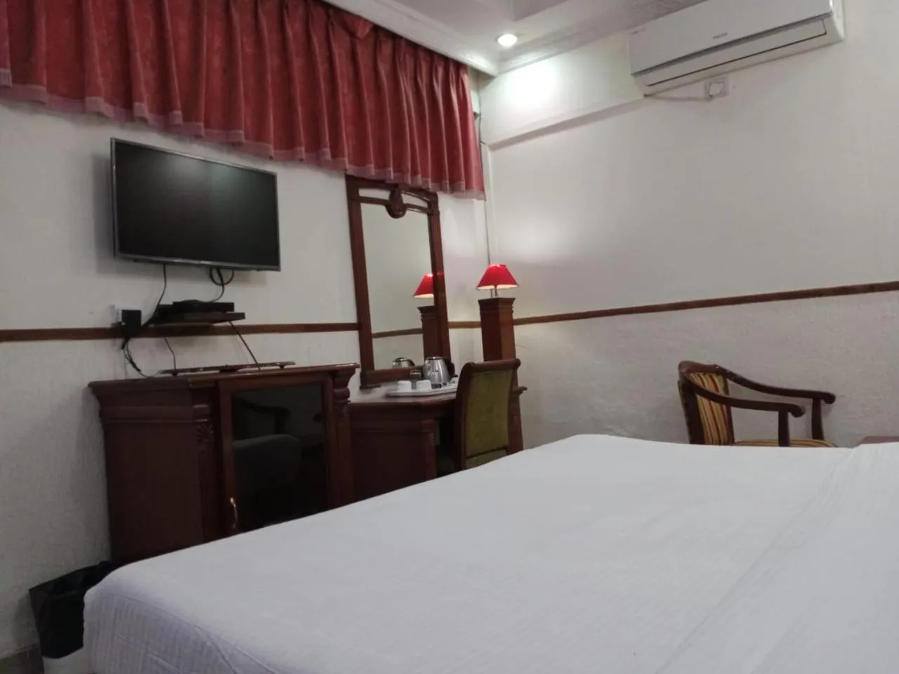 Bed in HOTEL CORPORATE INN