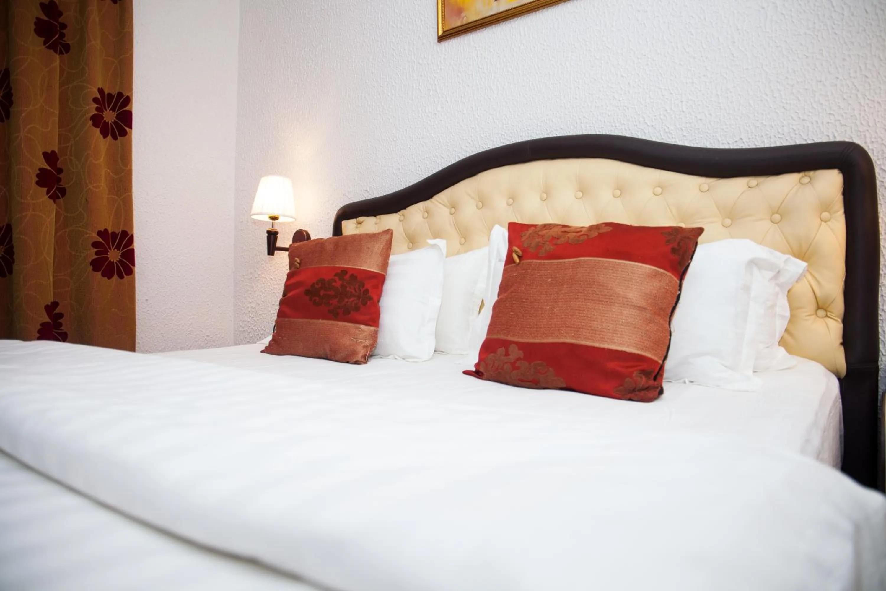 Bed in Millenium Popo Beach Hotel