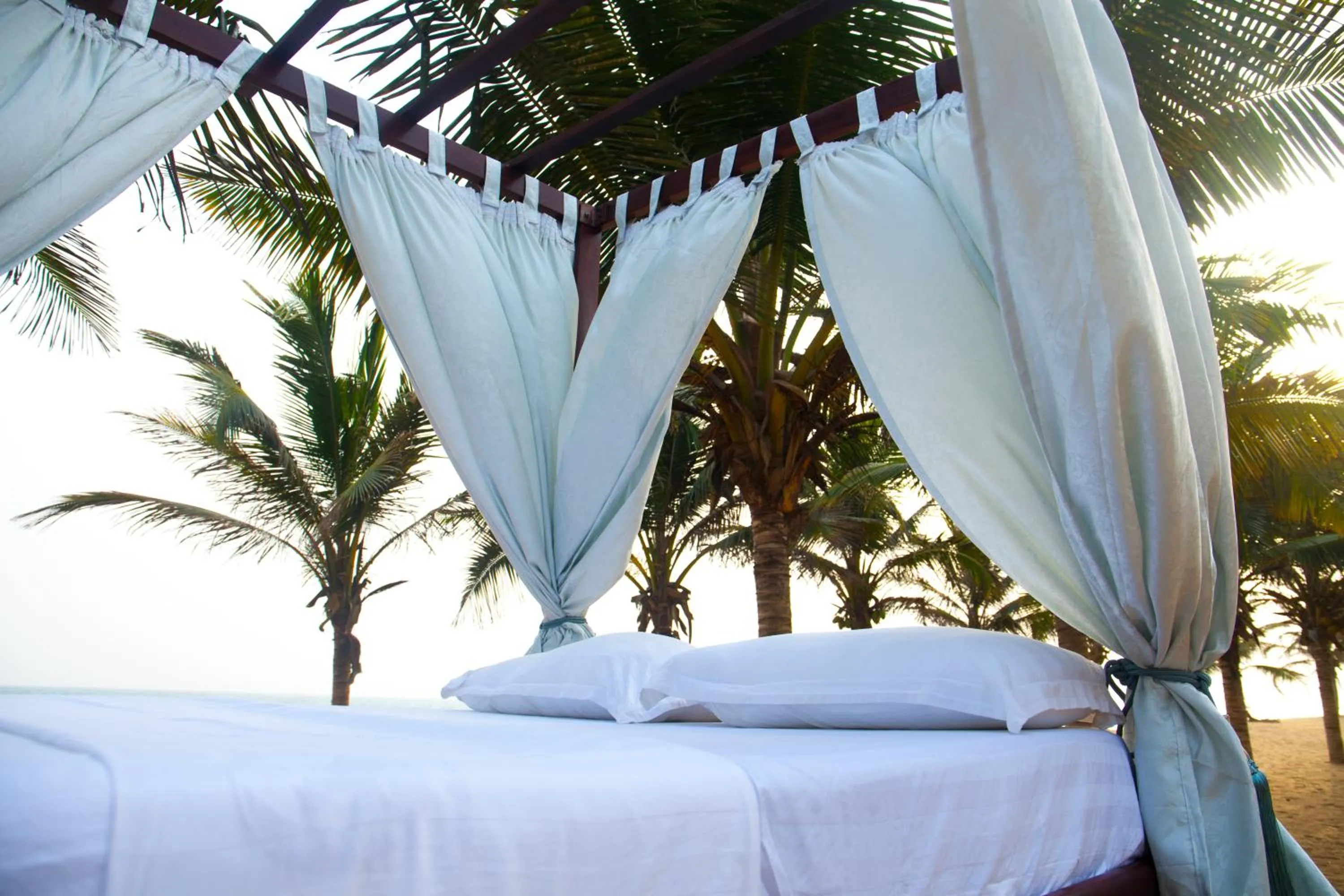 Bed in Millenium Popo Beach Hotel