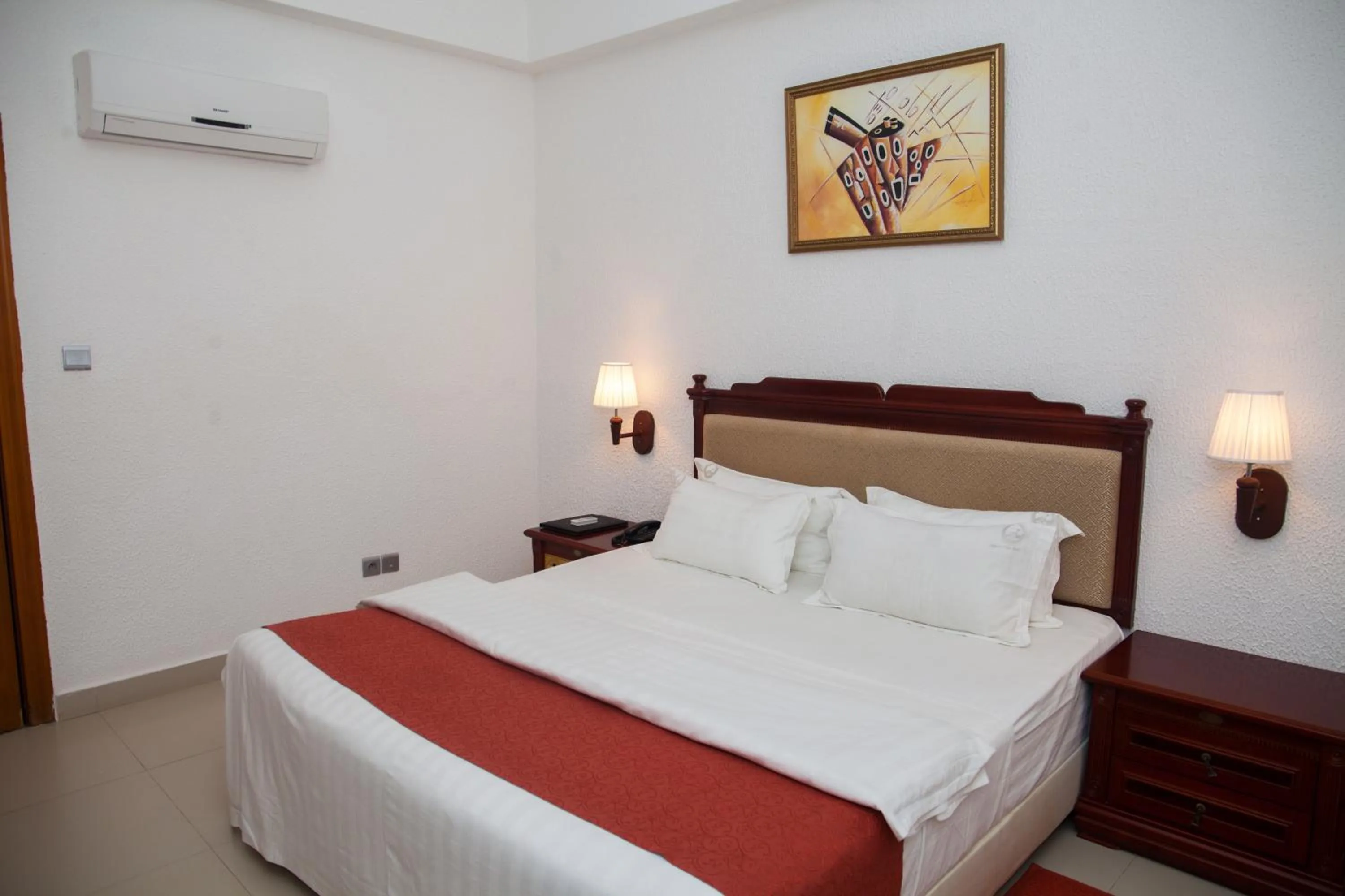 Bed in Millenium Popo Beach Hotel