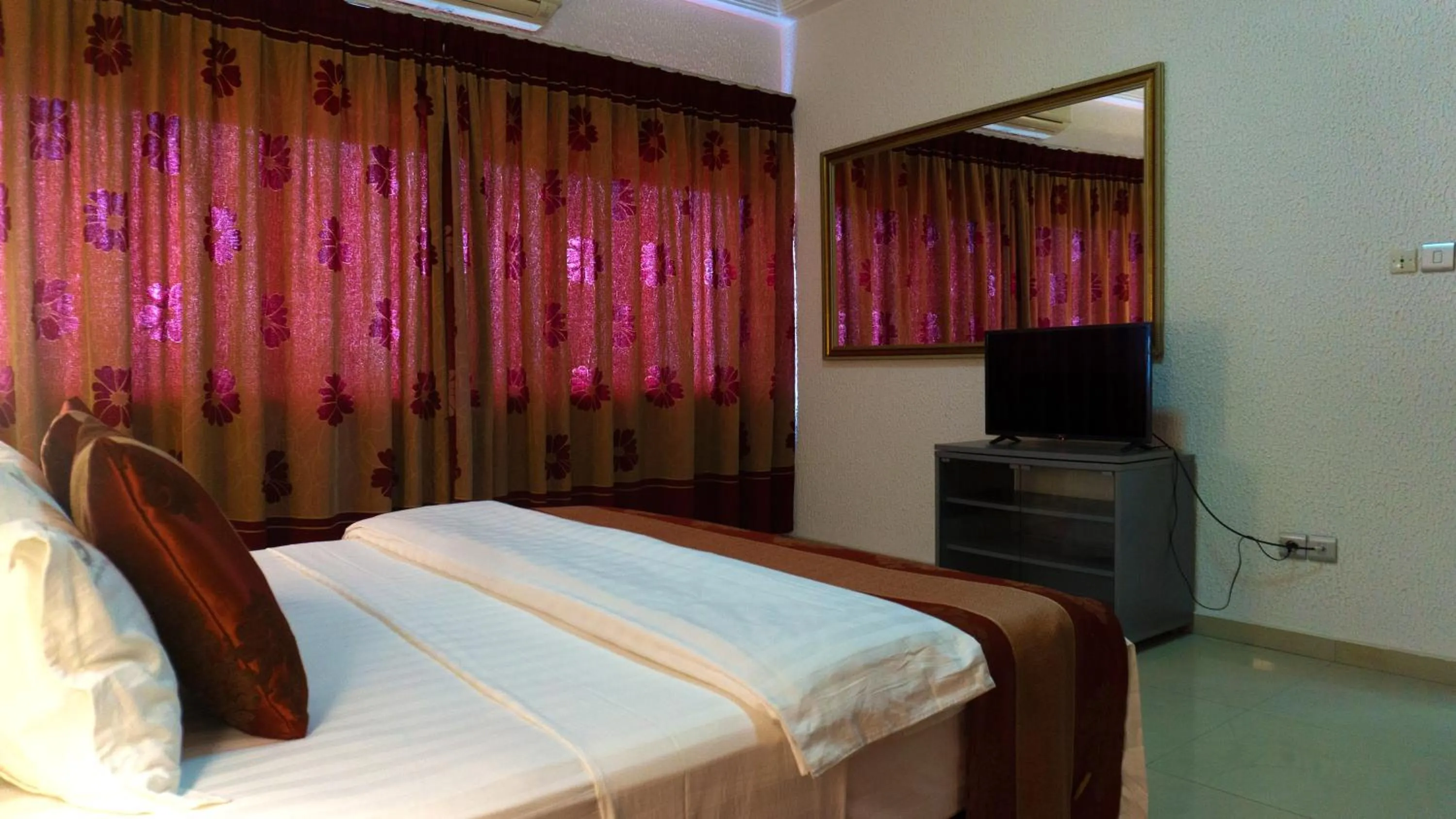 Bed in Millenium Popo Beach Hotel