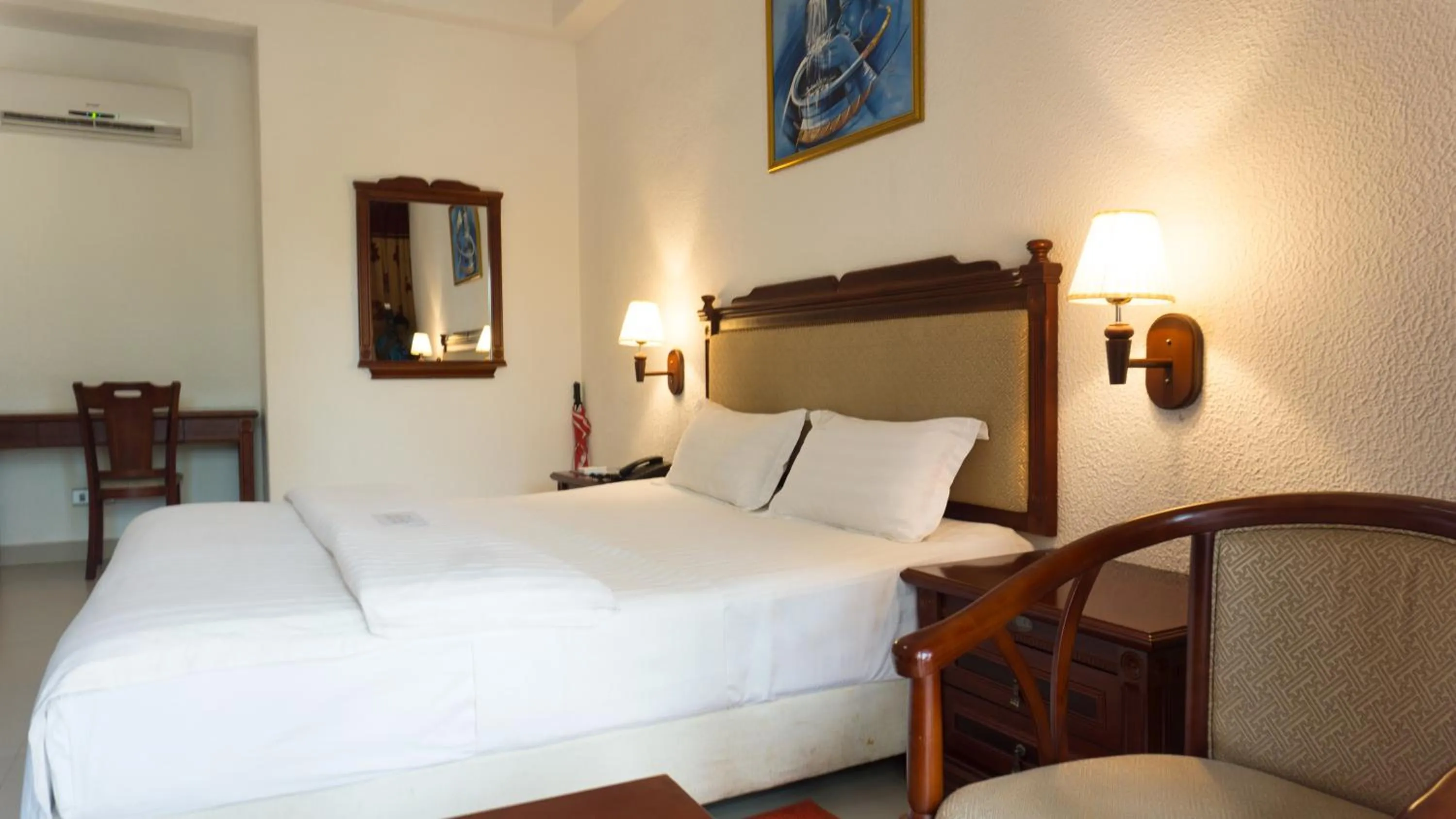 Bed in Millenium Popo Beach Hotel