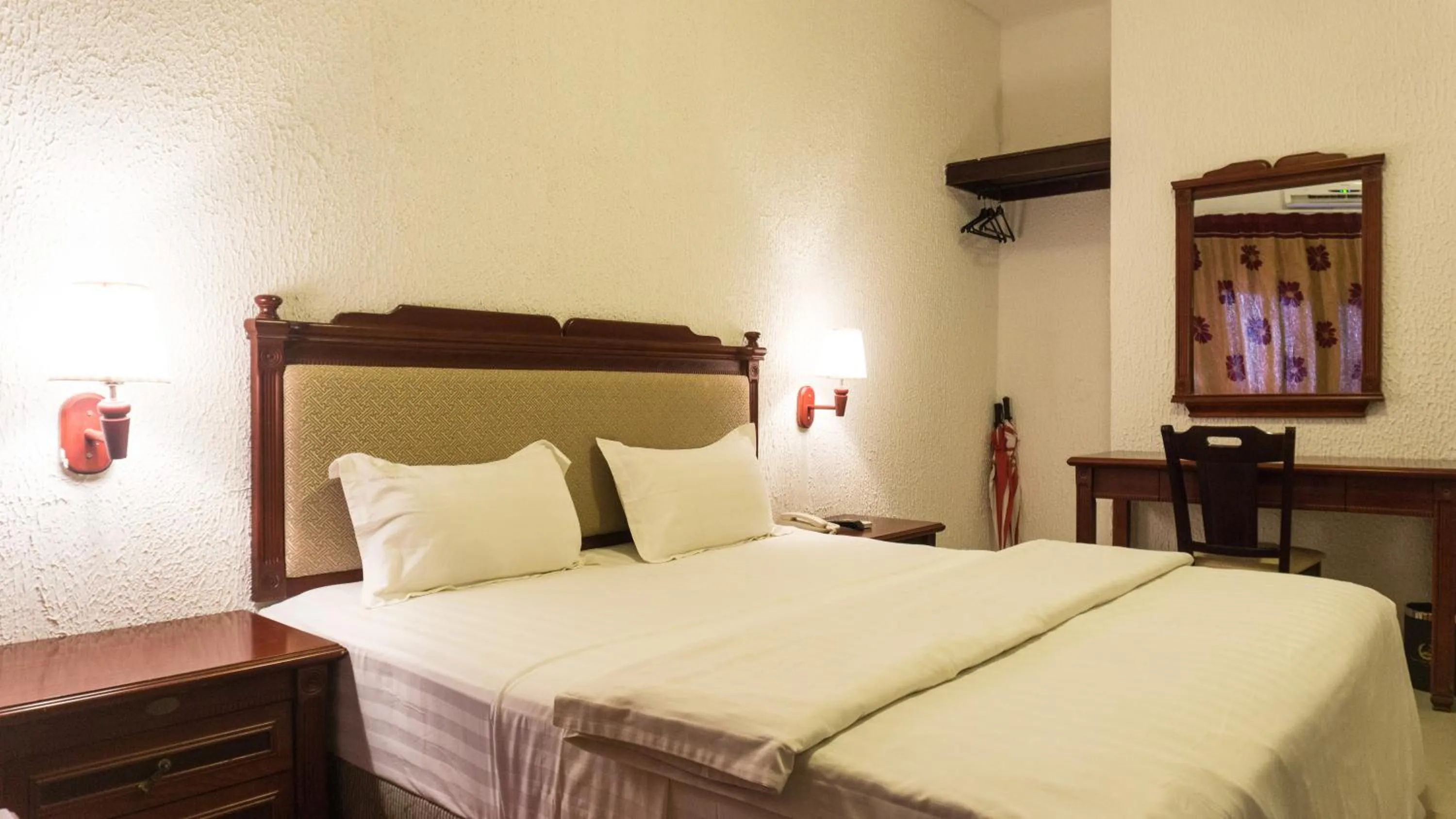 Bed in Millenium Popo Beach Hotel