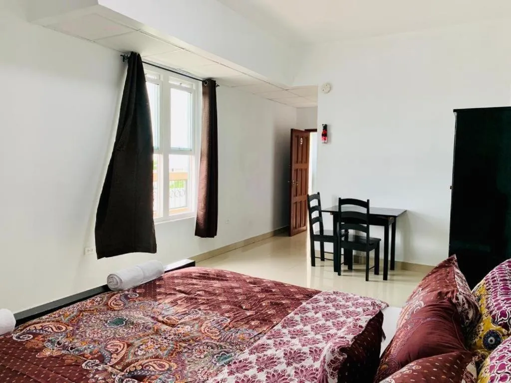 Bed in Hotel Coastalbay 2 & Golf Cart Rental