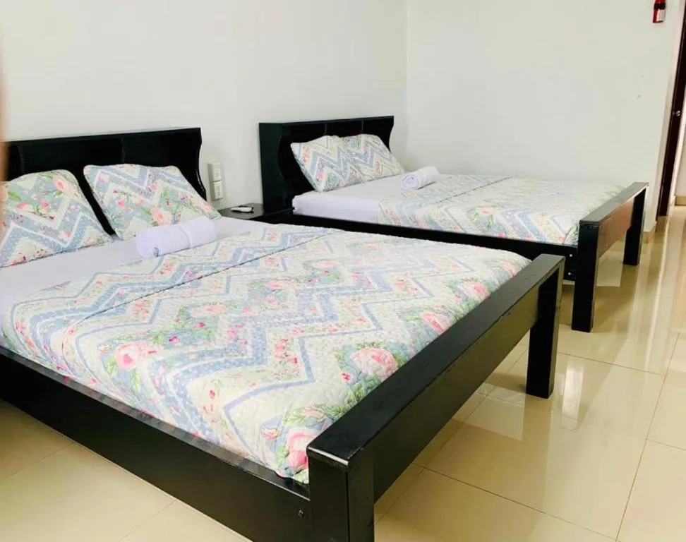 Bed in Hotel Coastalbay 2 & Golf Cart Rental