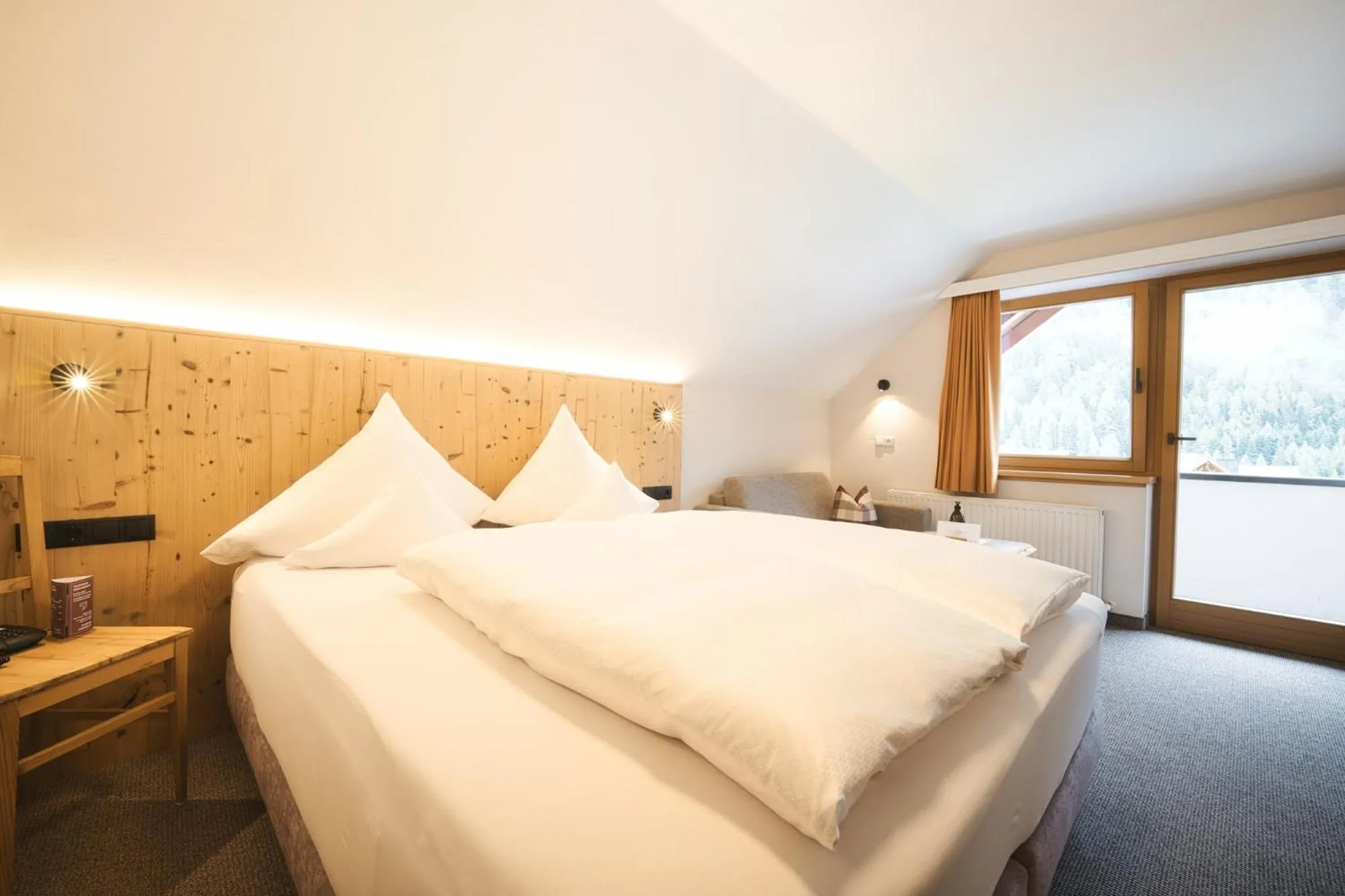 Photo of the whole room, Bed in Hotel Die Arlbergerin - Design & Tiroler Gemütlichkeit