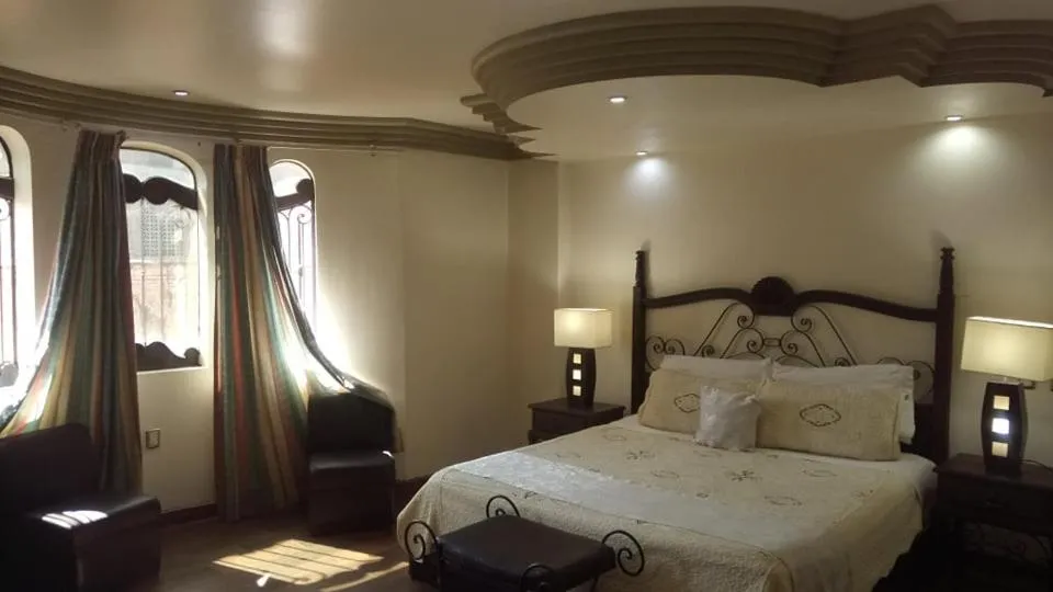 Bed in Hotel Hacienda los Narcisos