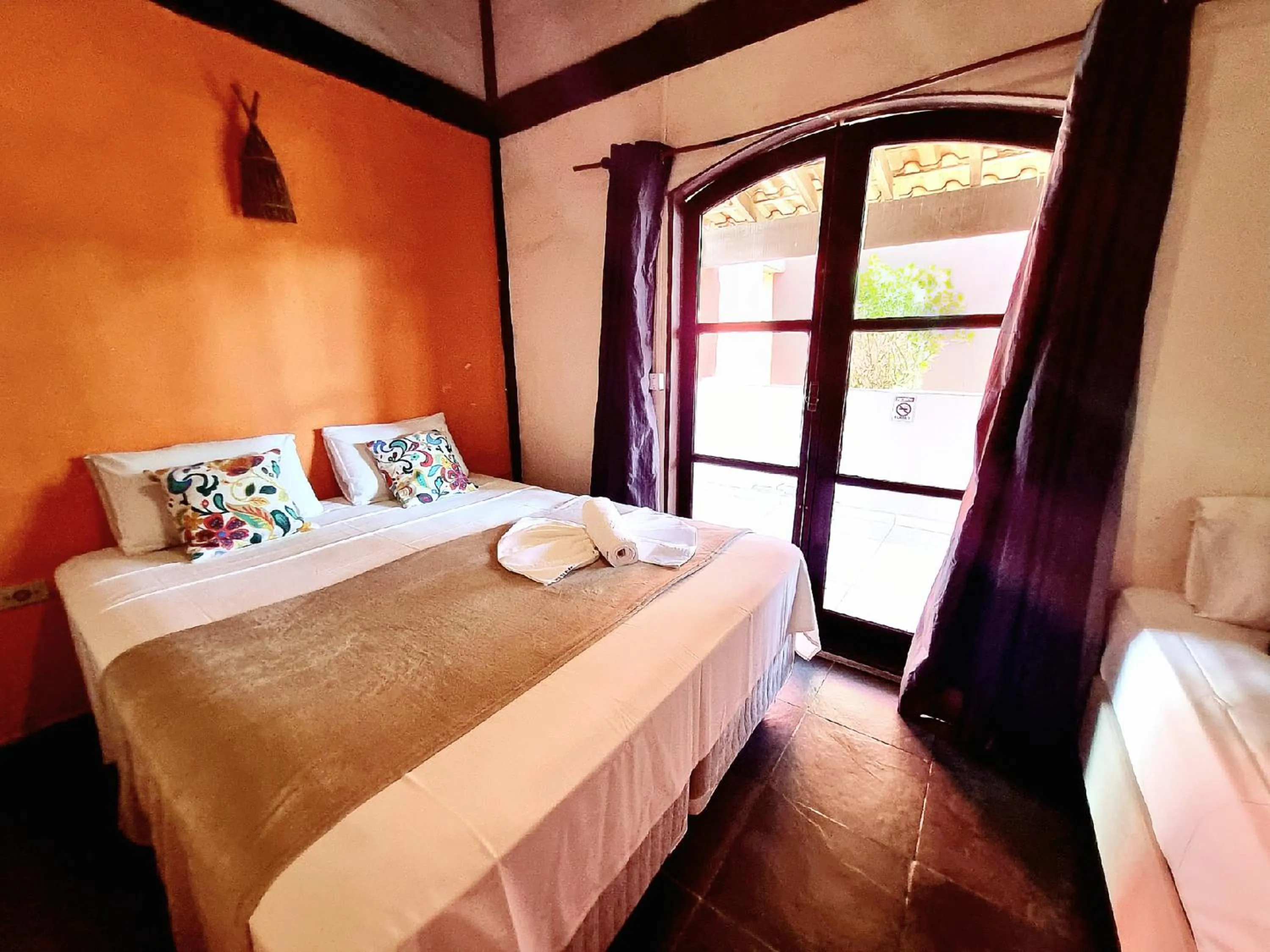 Bed in Pousada Delta Mar Maresias