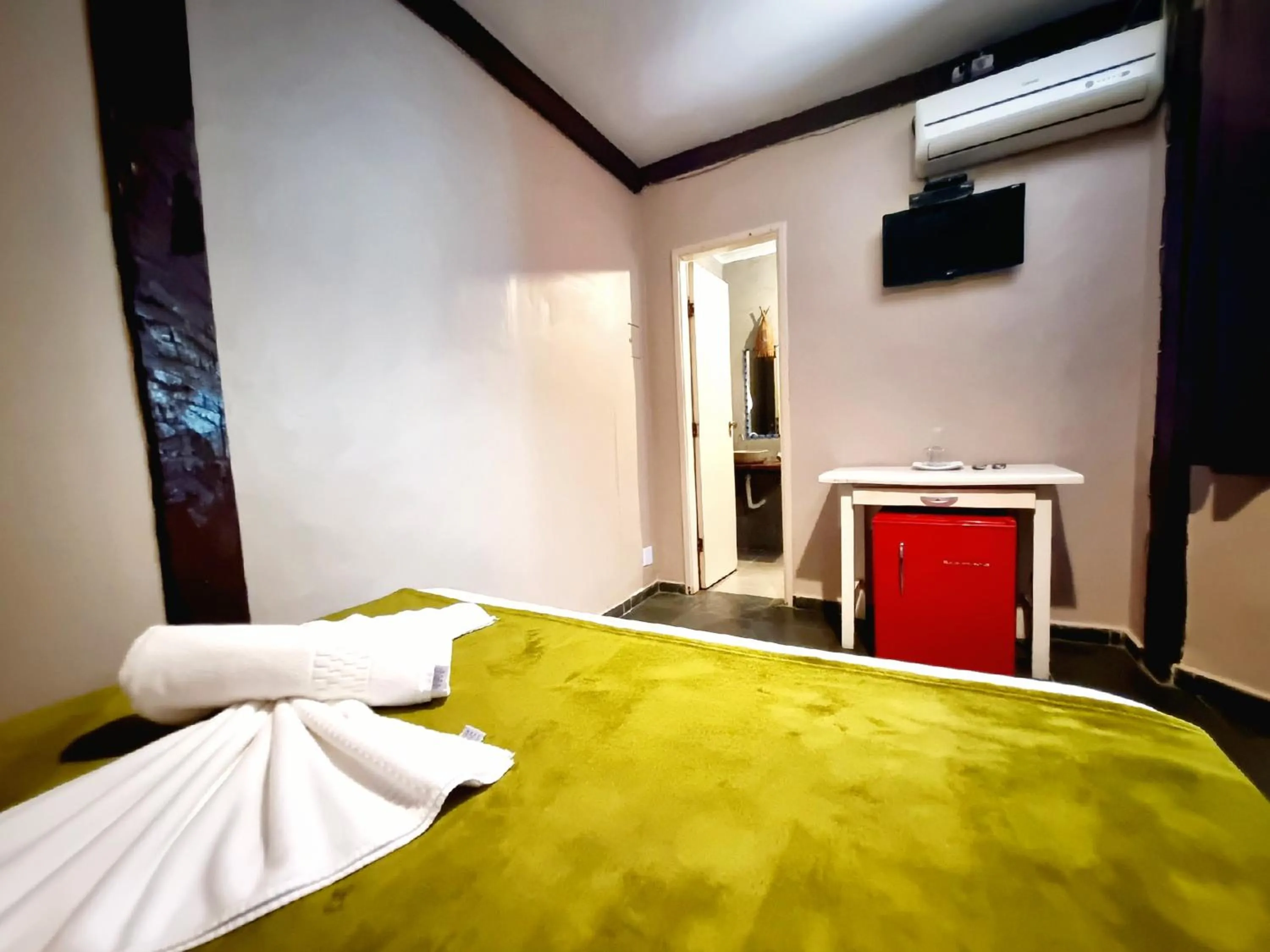 Bed in Pousada Delta Mar Maresias