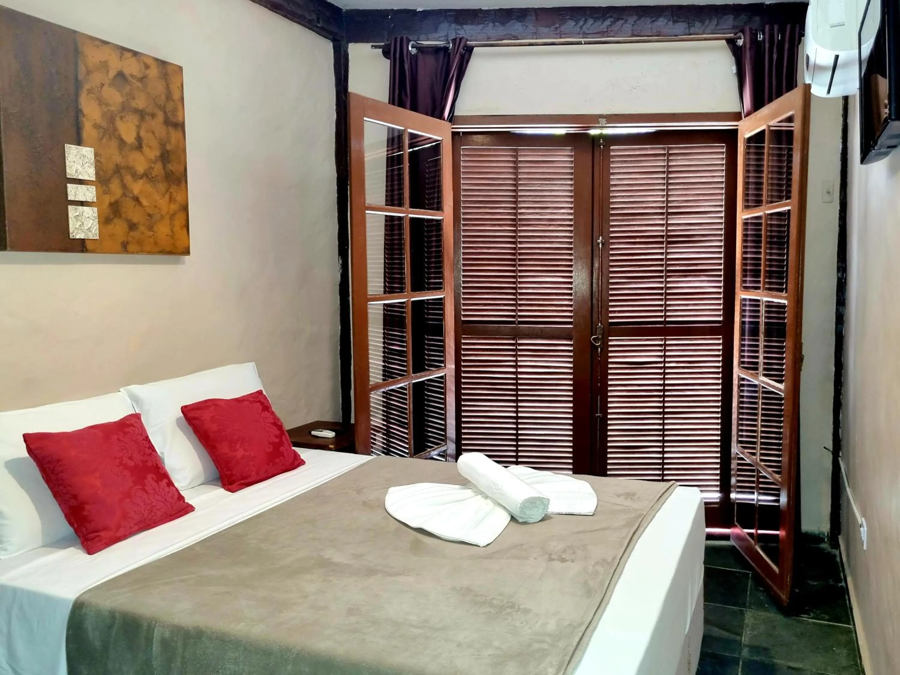 Bed in Pousada Delta Mar Maresias