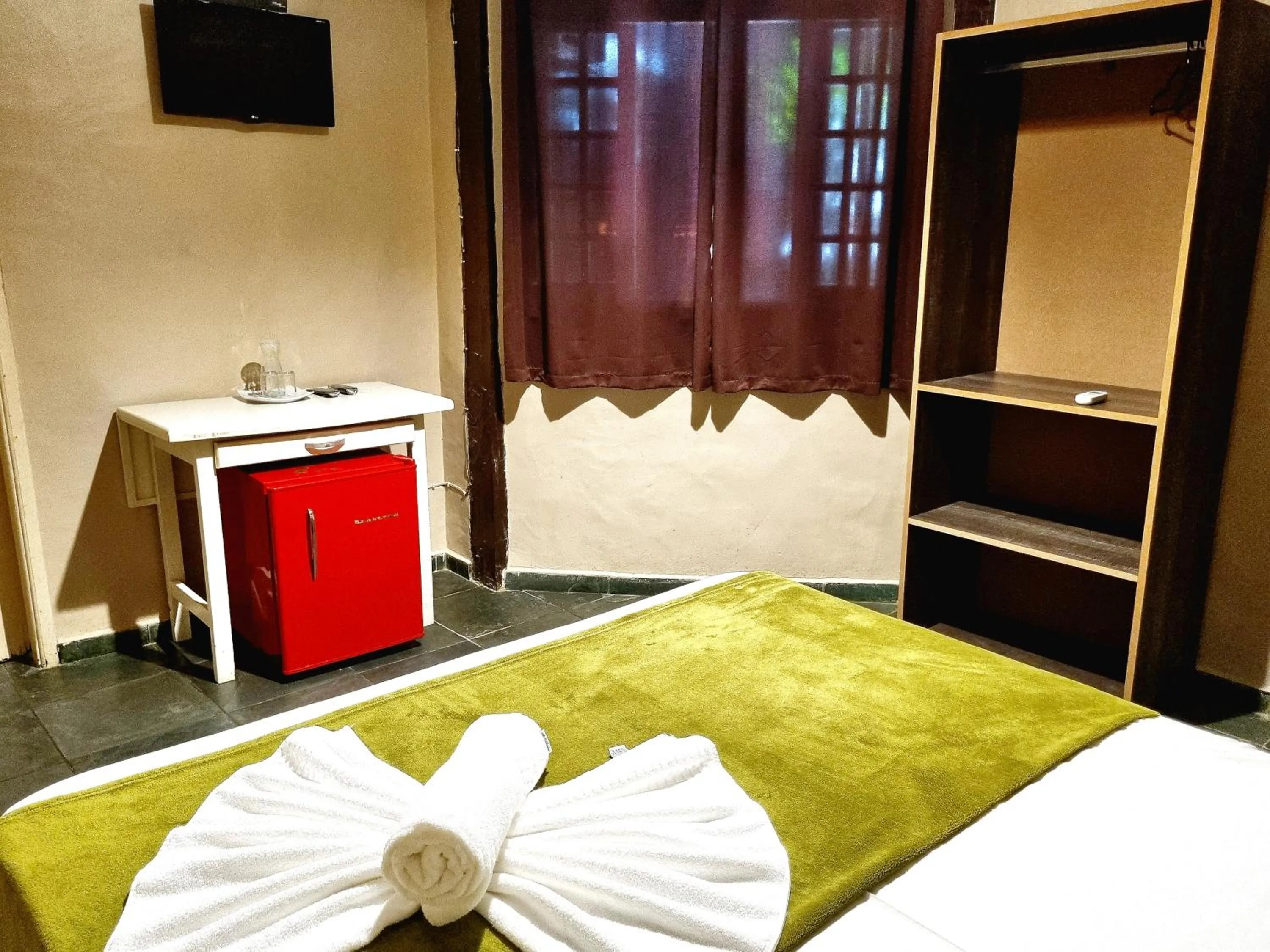 Bed in Pousada Delta Mar Maresias