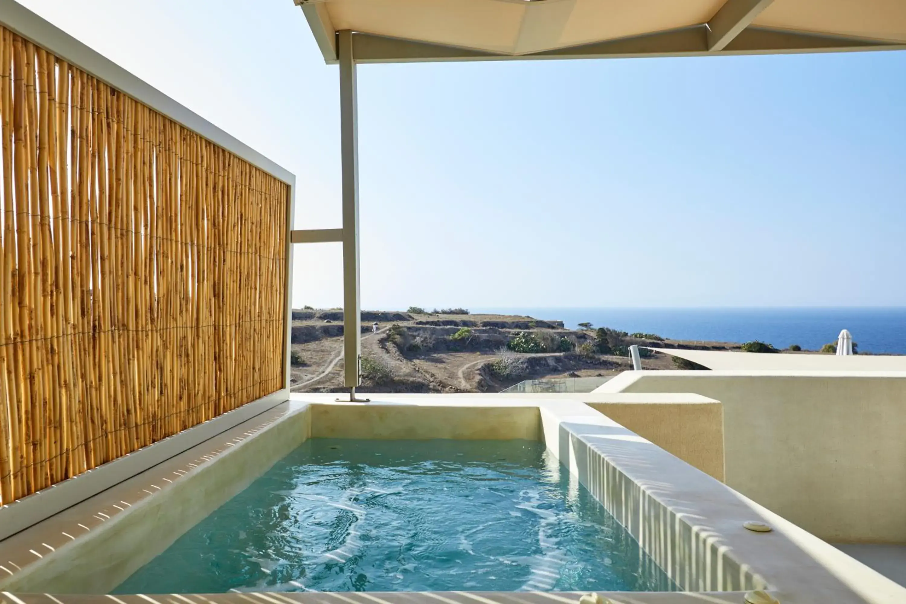 King Suite with outdoor heated Hot Hydromassage Tub in Adorno Oia King Suite with outdoor heated Hot Hydromassage Tub in Adorno Oia