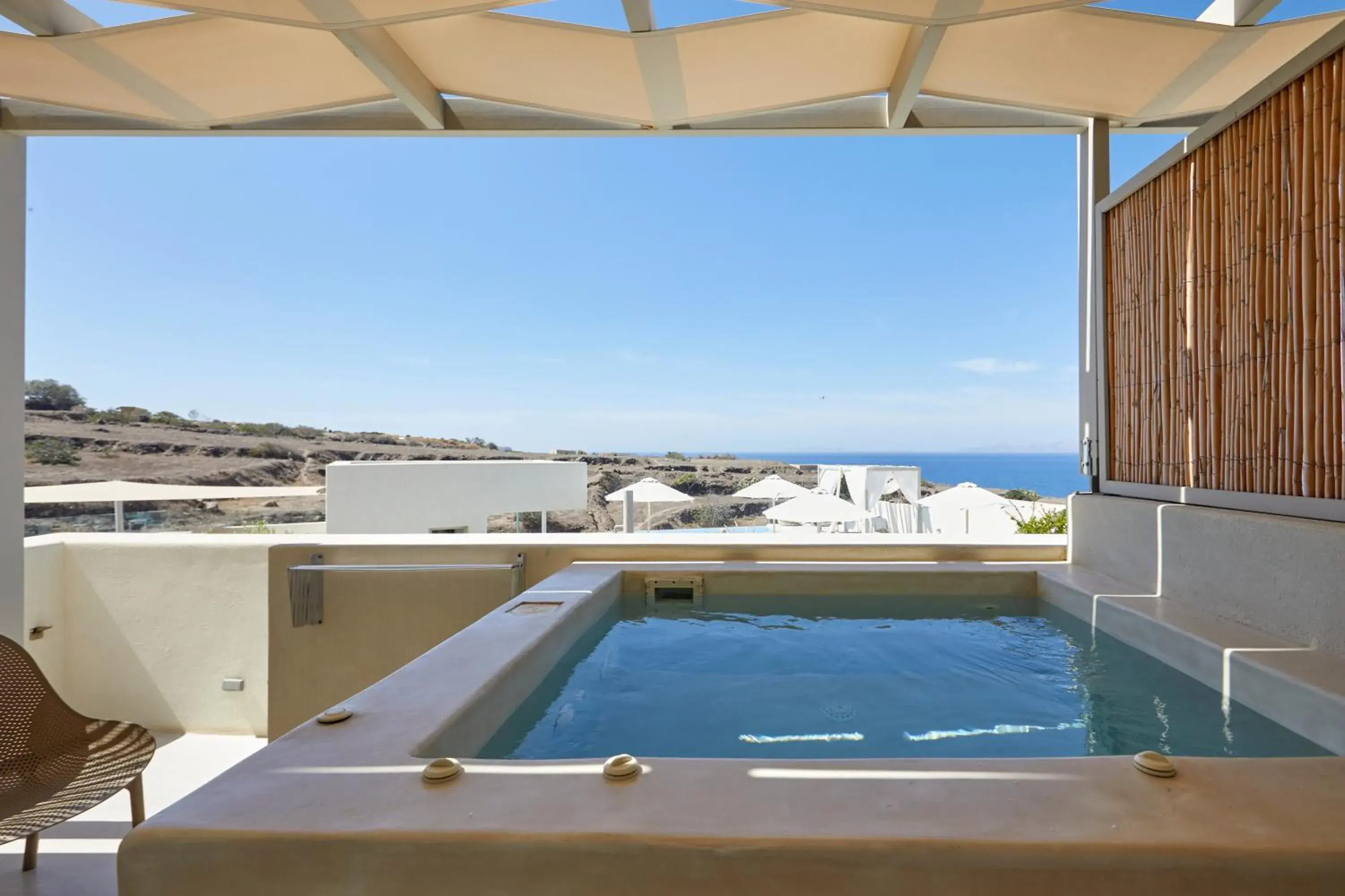 Queen Suite with outdoor heated Hot Hydromassage Tub in Adorno Oia Queen Suite with outdoor heated Hot Hydromassage Tub in Adorno Oia
