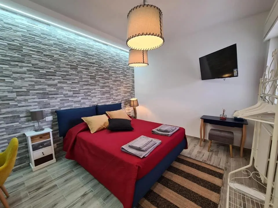 Bed in Le Dimore del Gufo B&B and Apartments Suite