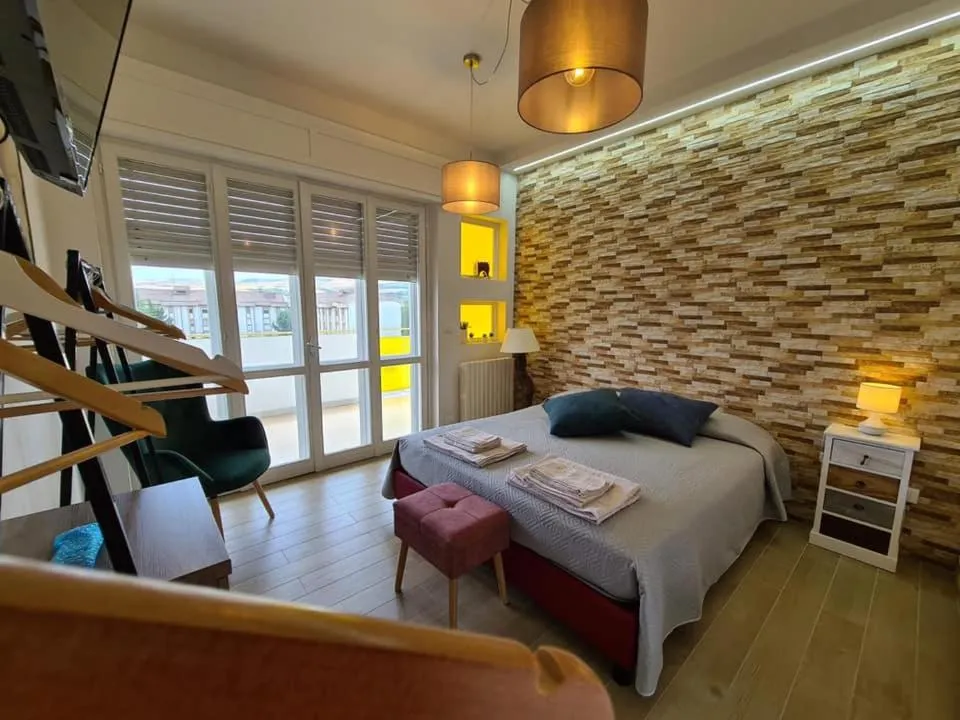 Bed in Le Dimore del Gufo B&B and Apartments Suite