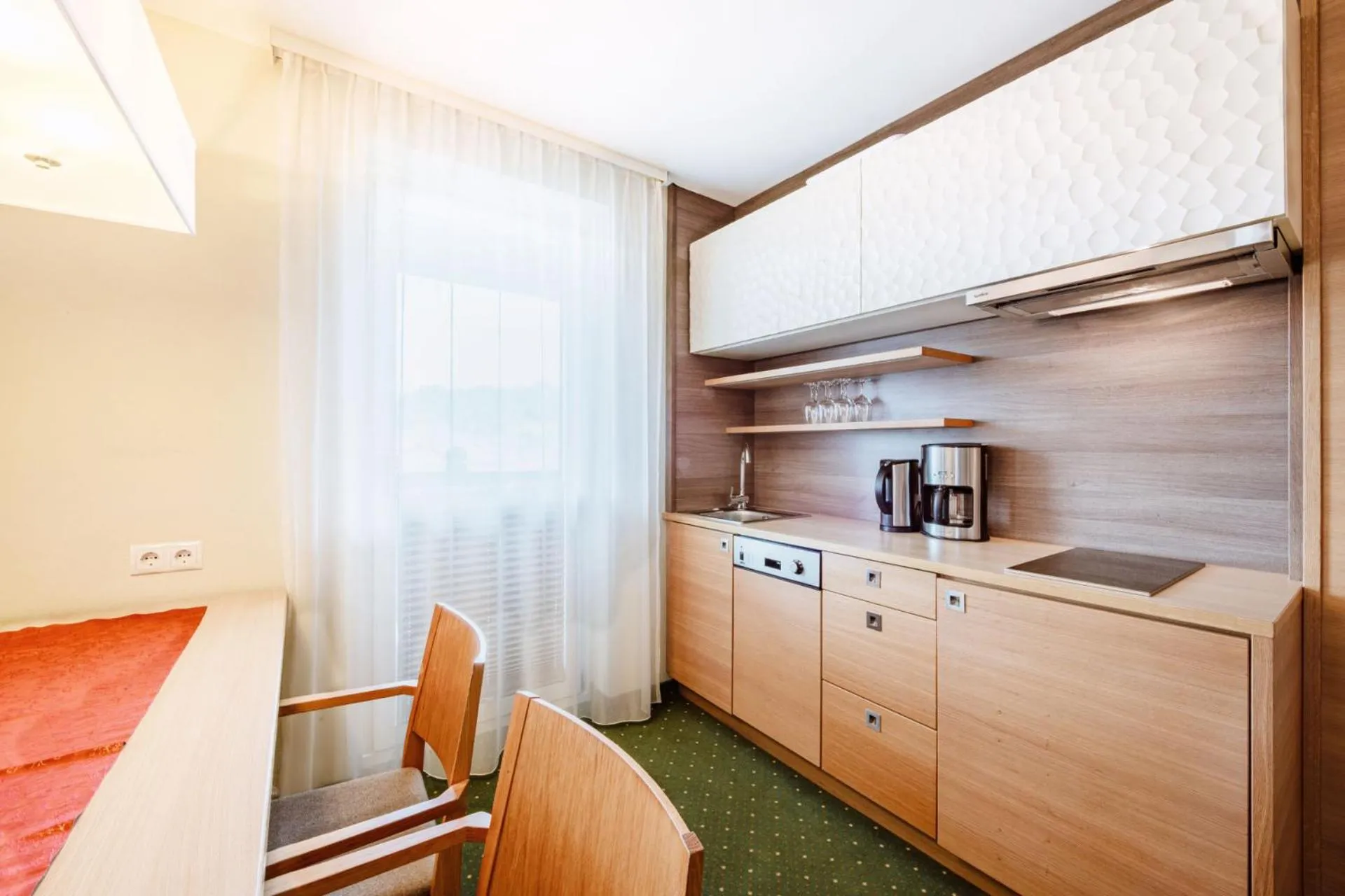Kitchen or kitchenette in Harmls Aparthotel